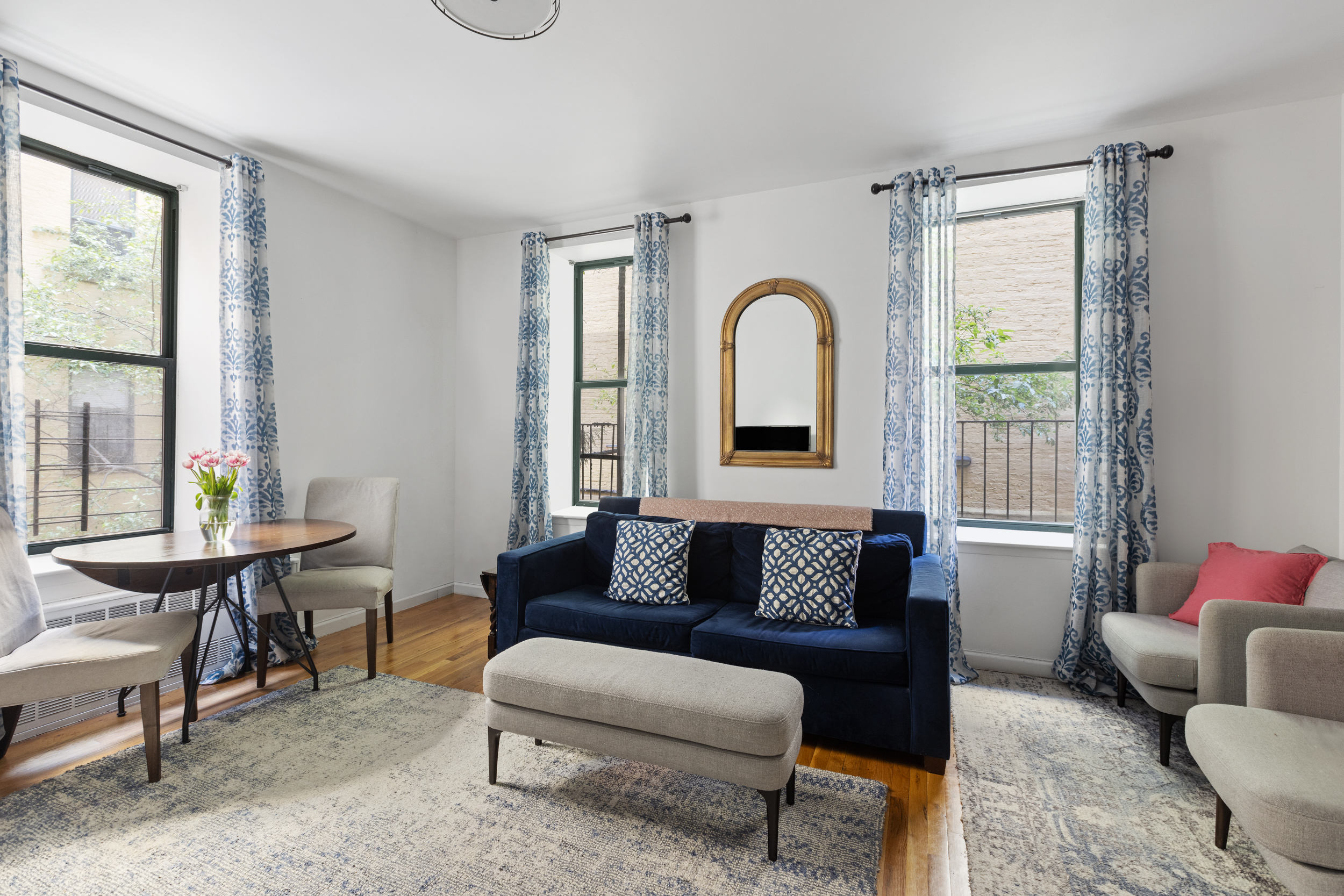 a living room with furniture and a window