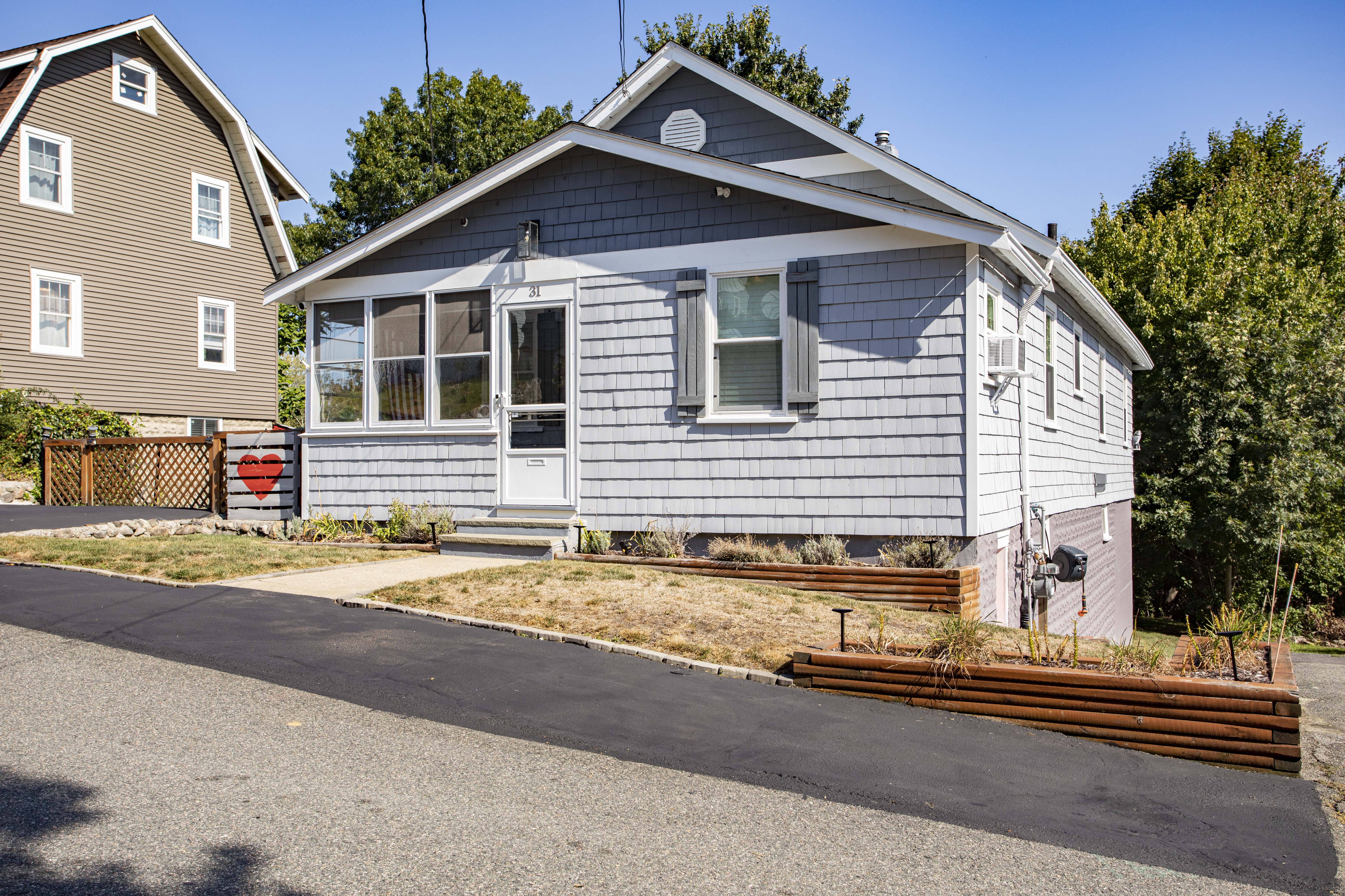 a front view of a house with a yard