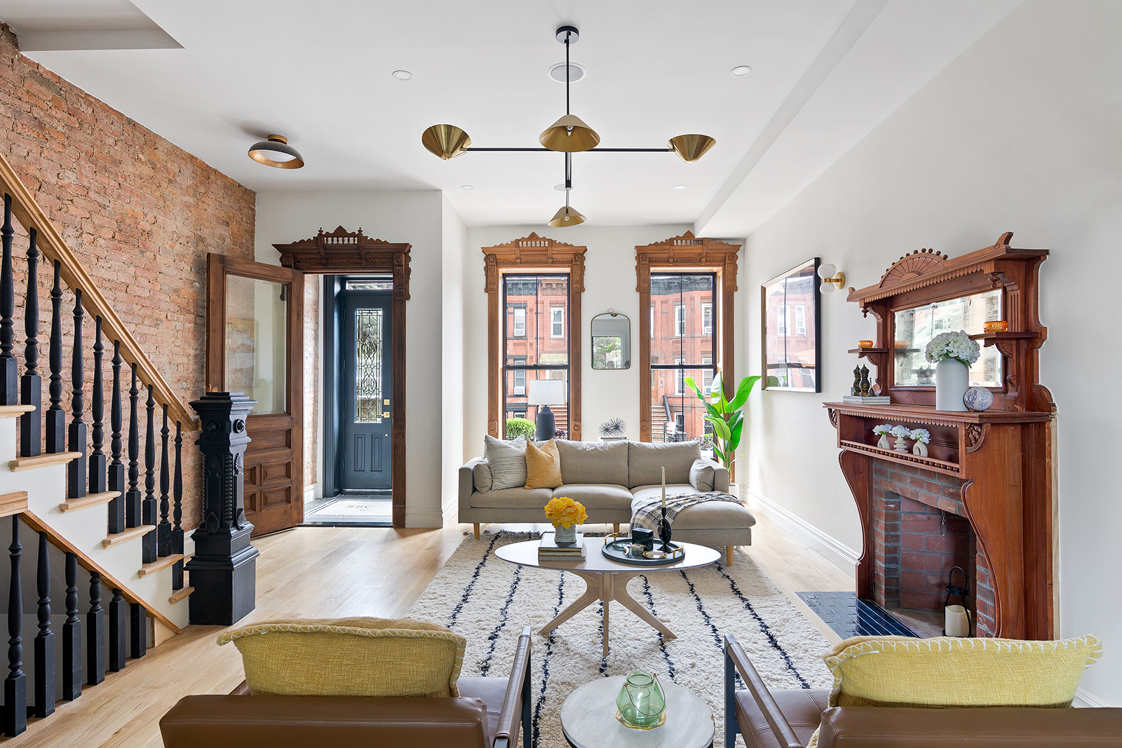 a living room with furniture a rug and a chandelier