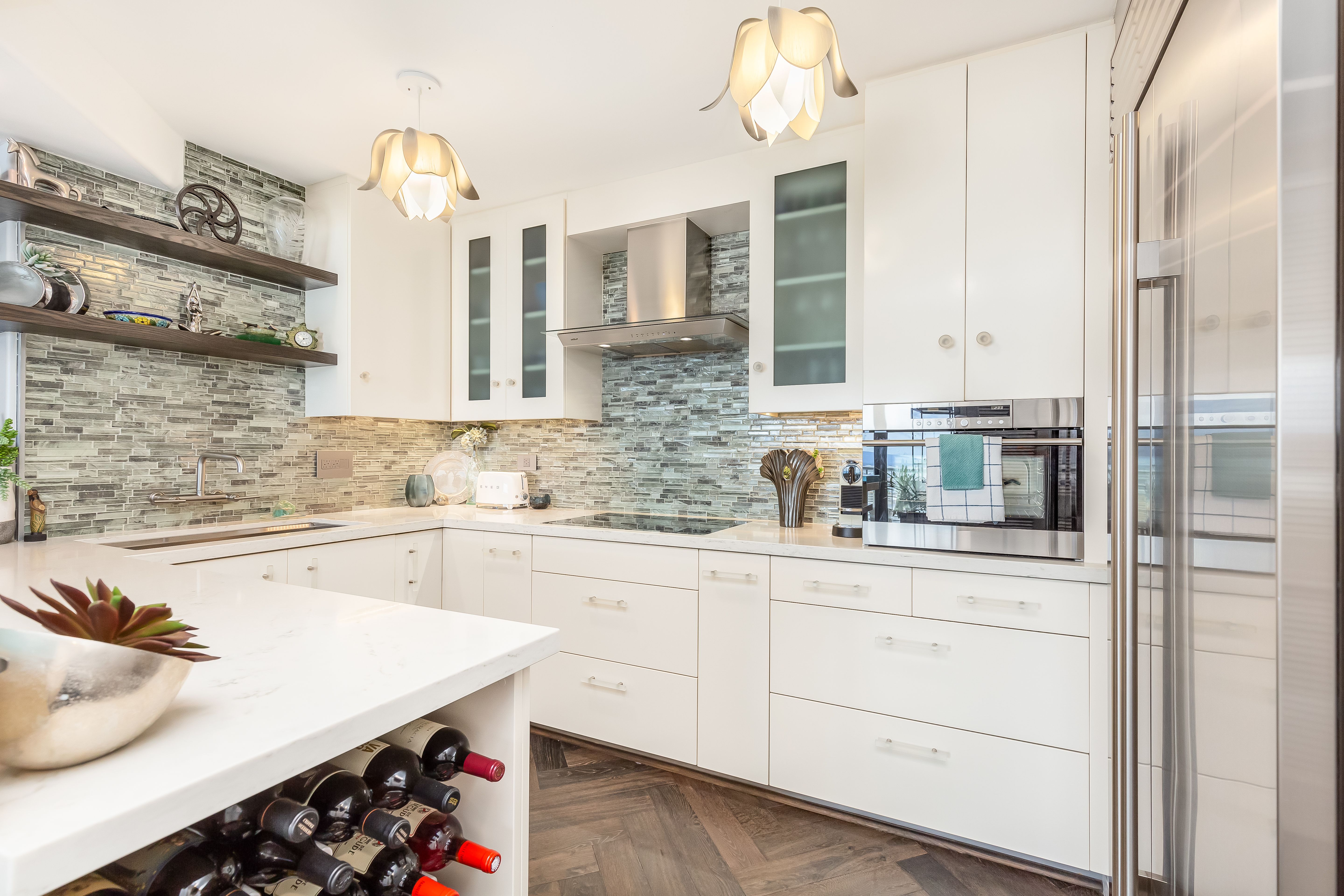 a kitchen with granite countertop white cabinets and white appliances