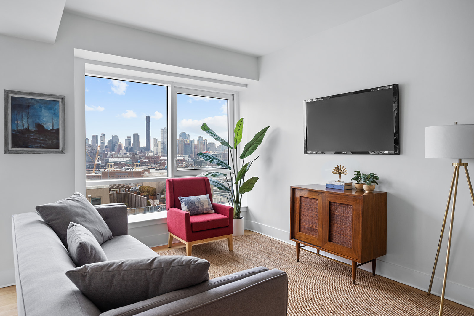 a living room with furniture and a flat screen tv