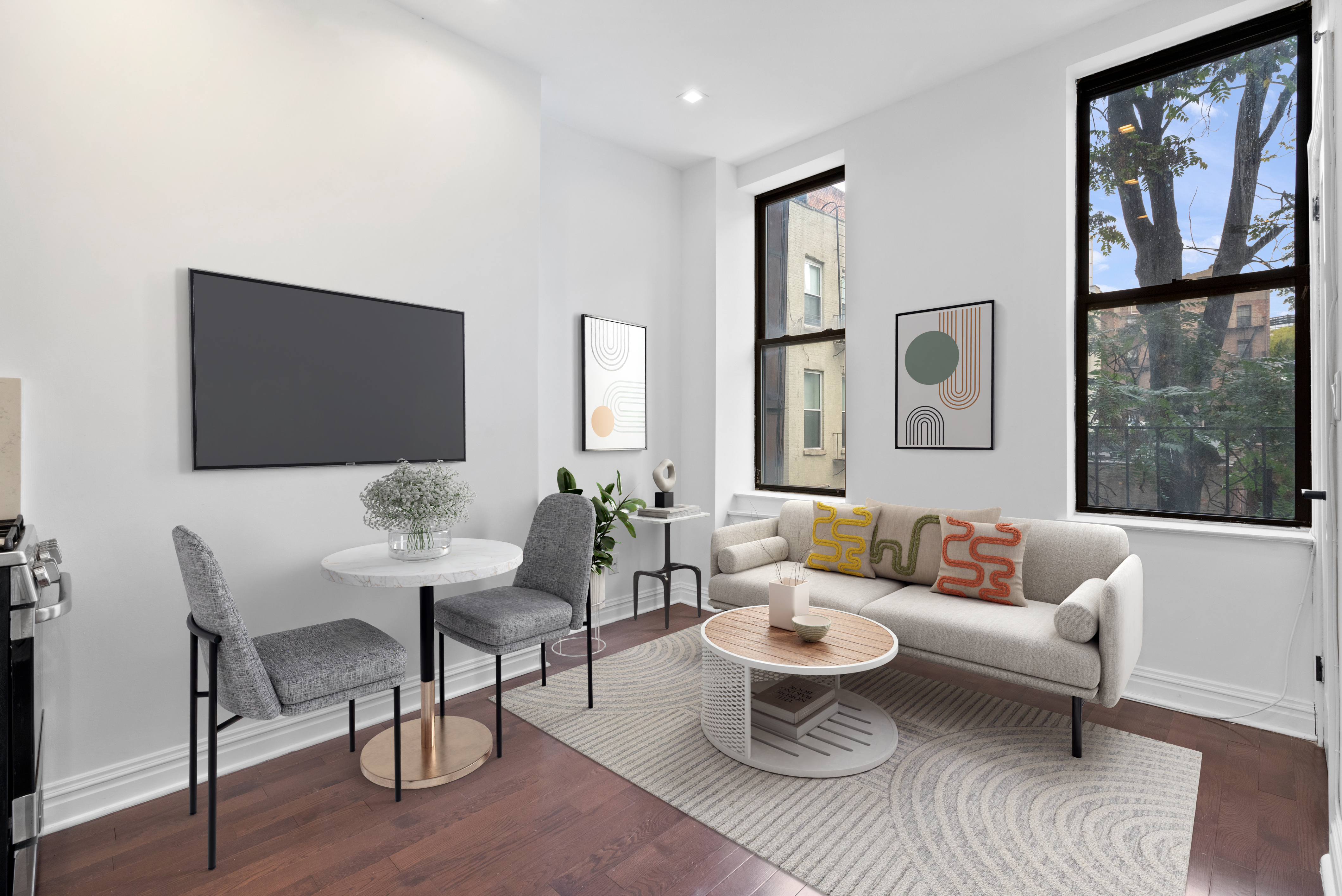 a living room with furniture a rug and a window