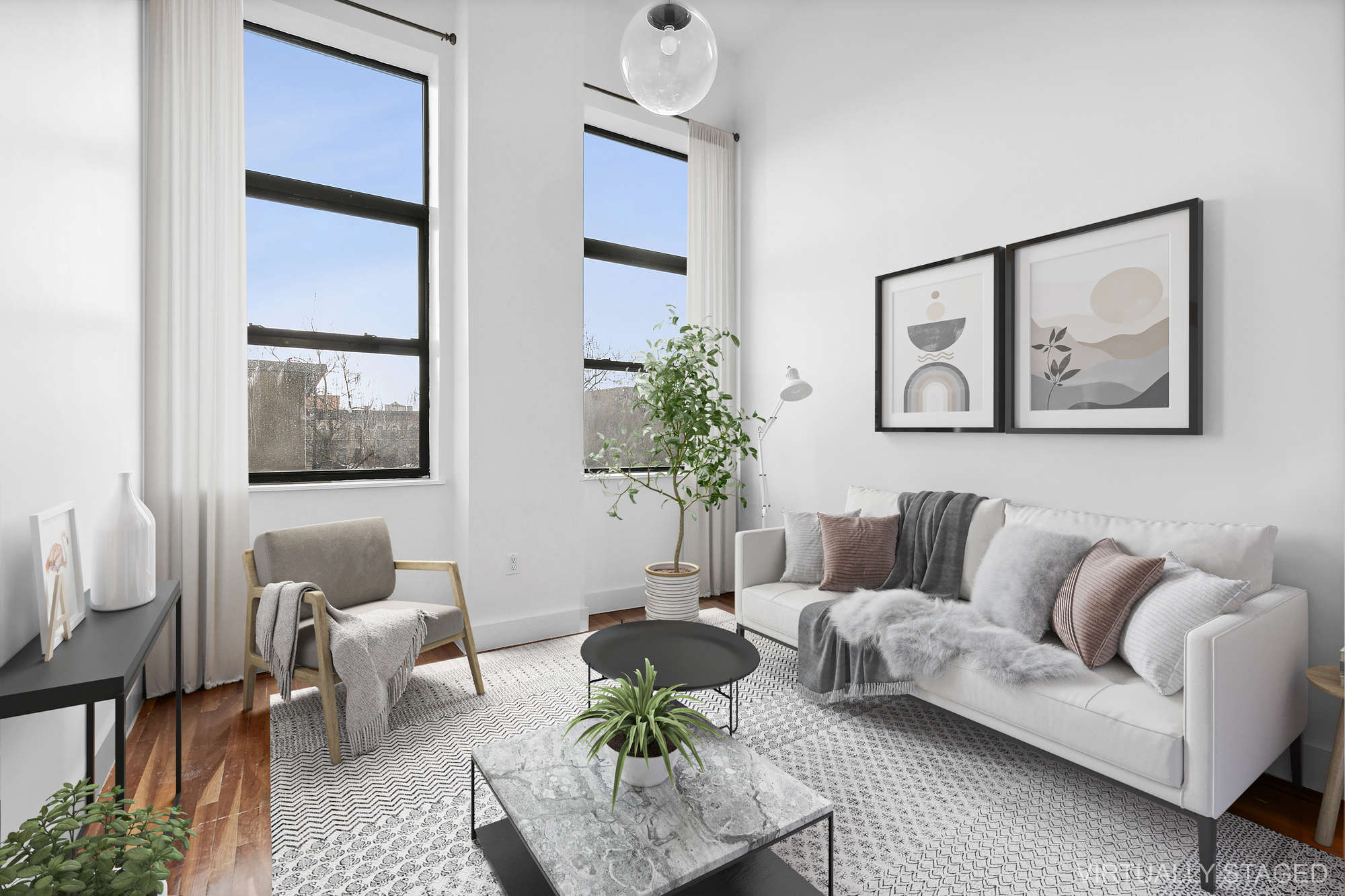 a living room with furniture and a painting on the wall