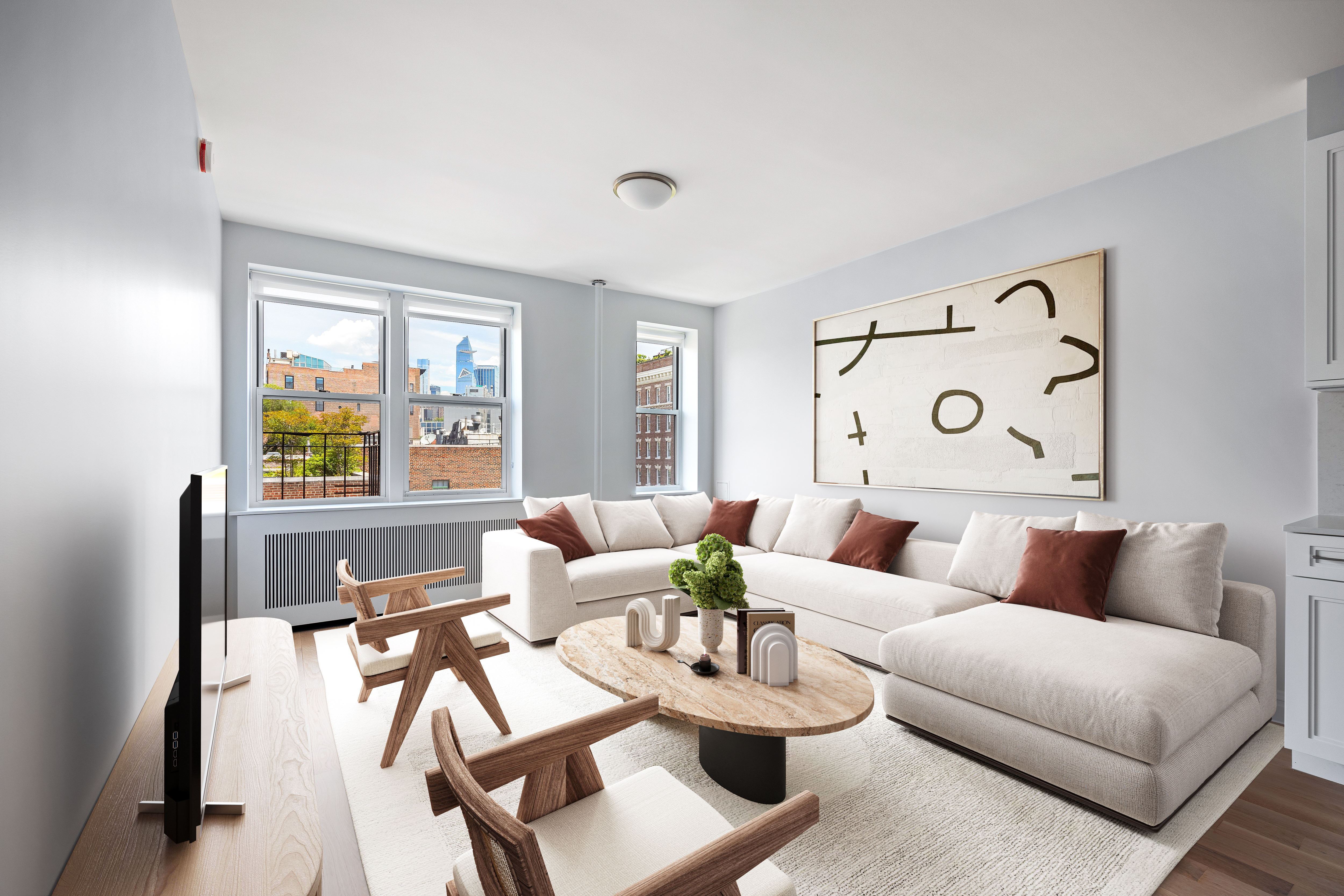 a living room with furniture and wooden floor