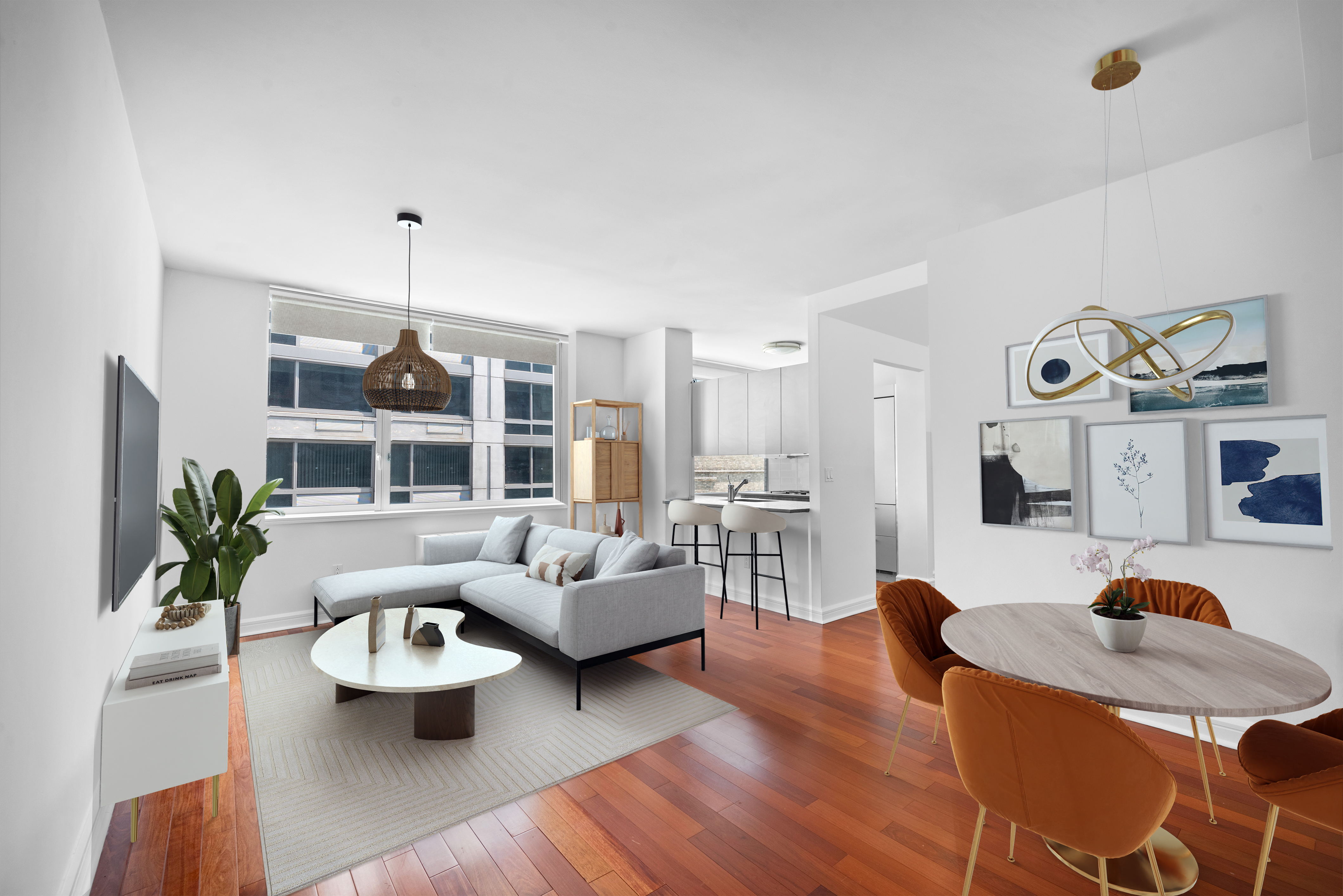 a living room with furniture and wooden floor