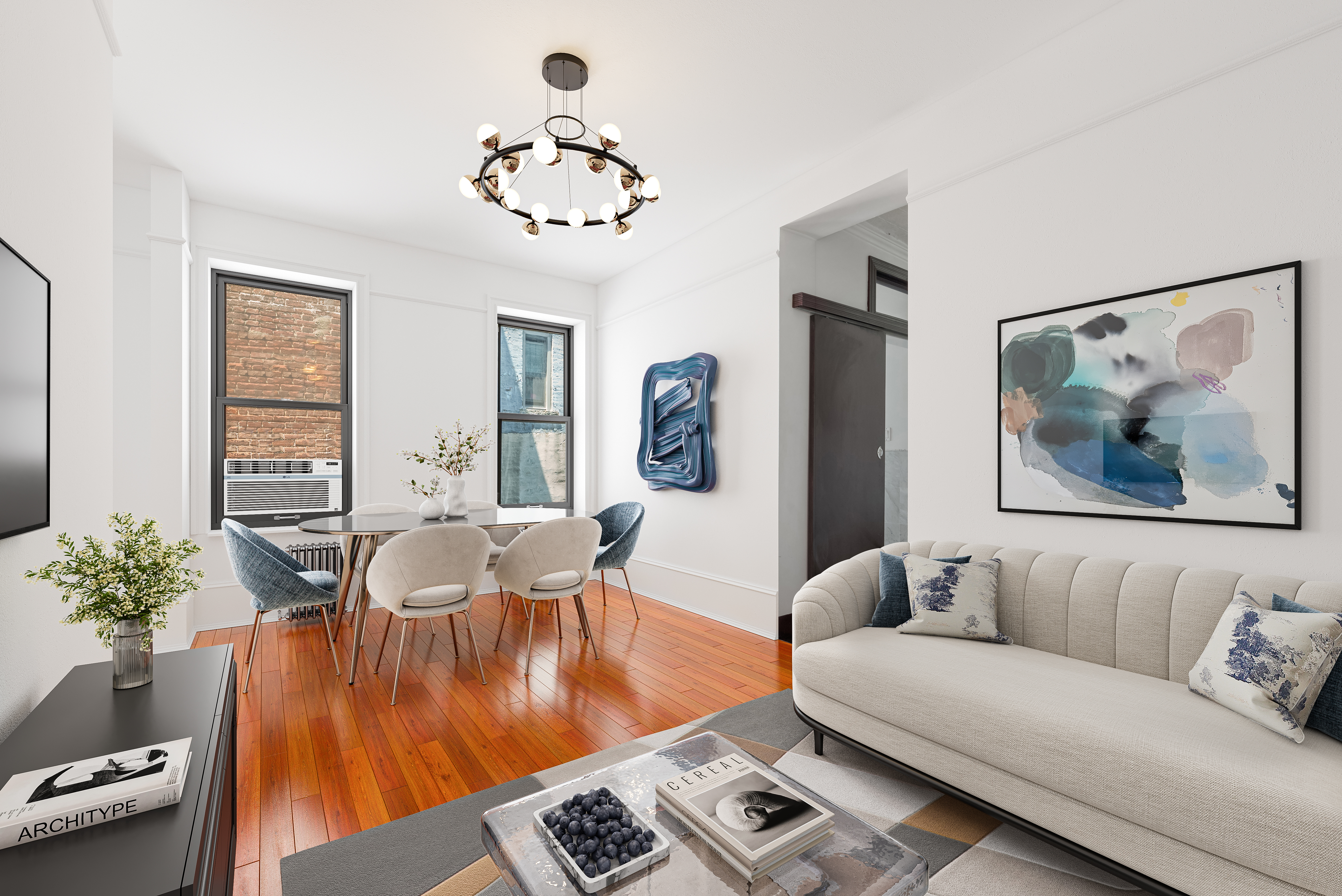 a living room with furniture and a chandelier