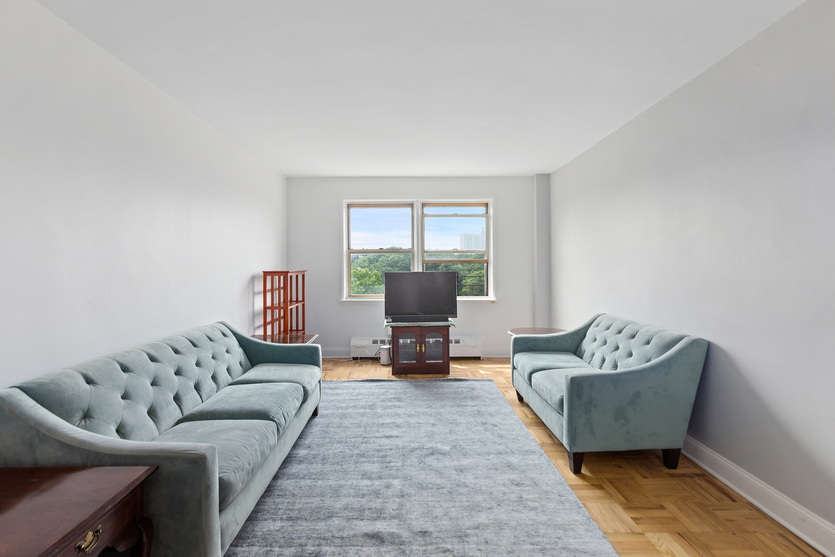 a living room with furniture and a lamp