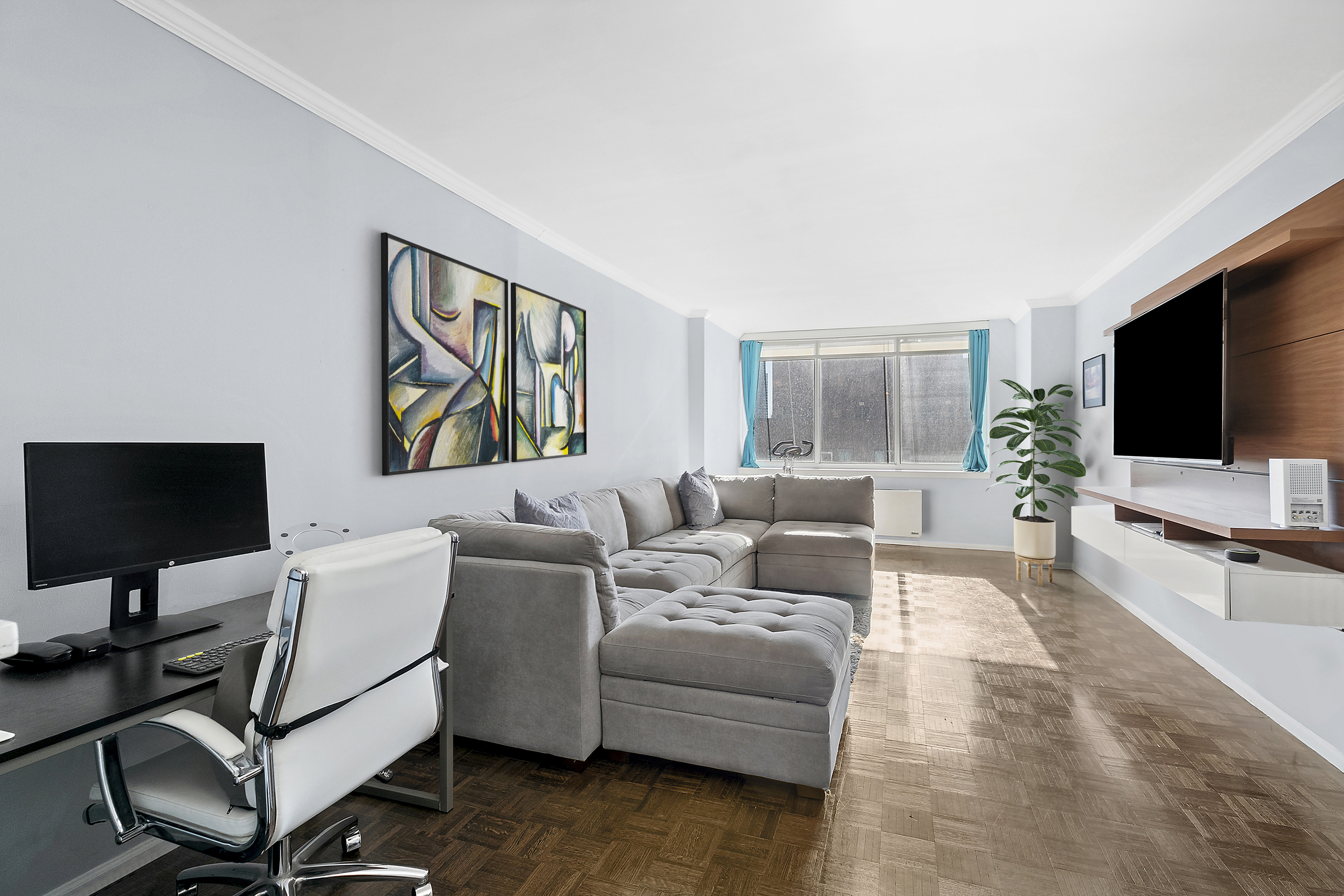 a living room with furniture and a flat screen tv