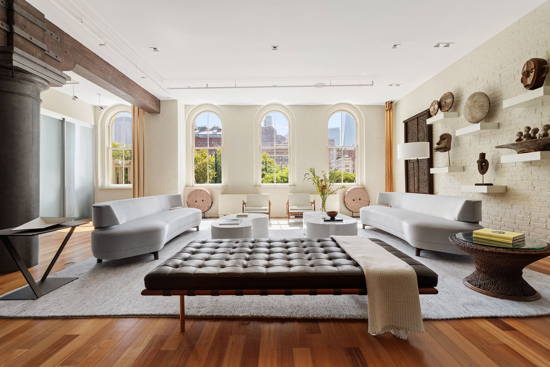 a living room with furniture rug and window