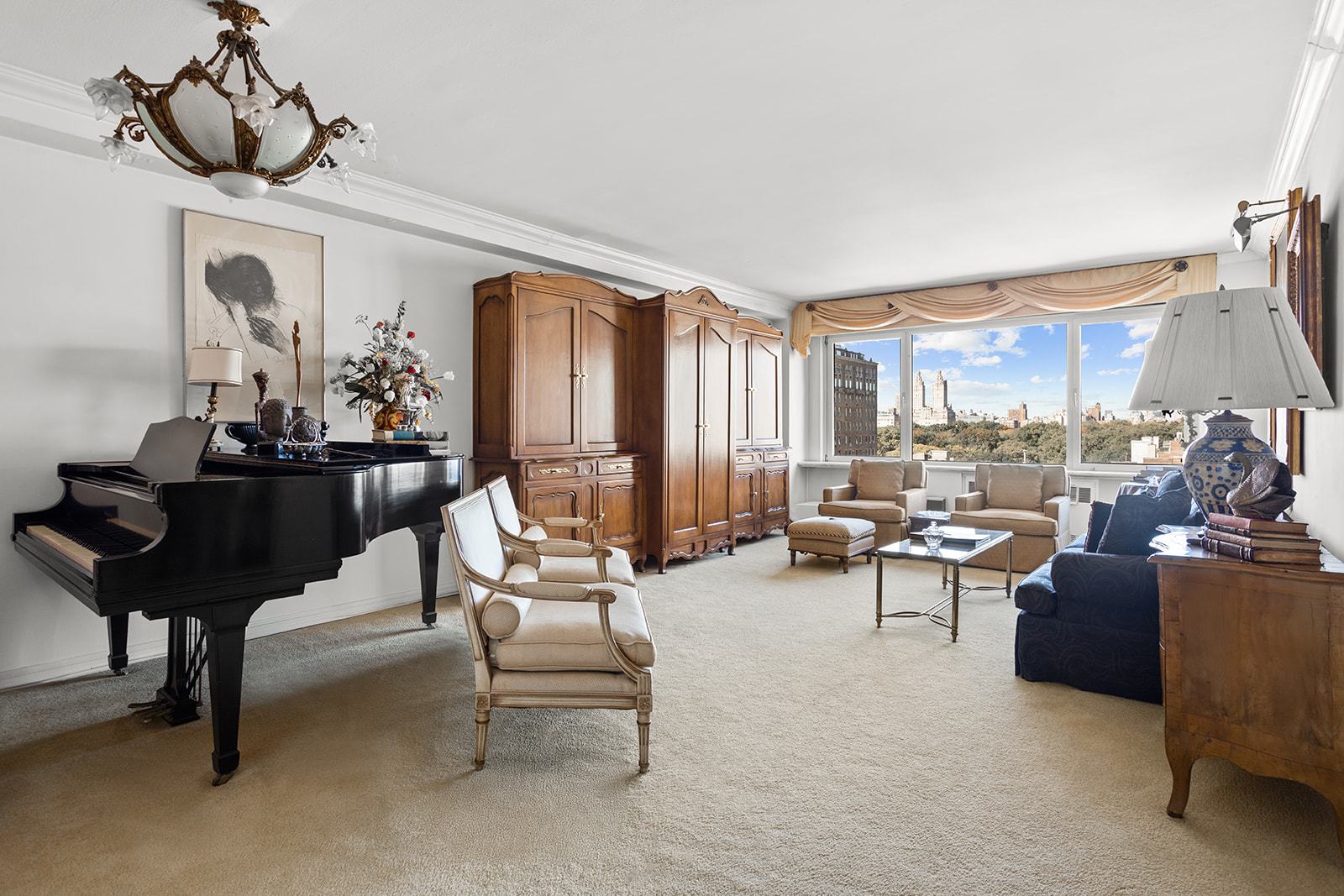 a living room with furniture and a chandelier