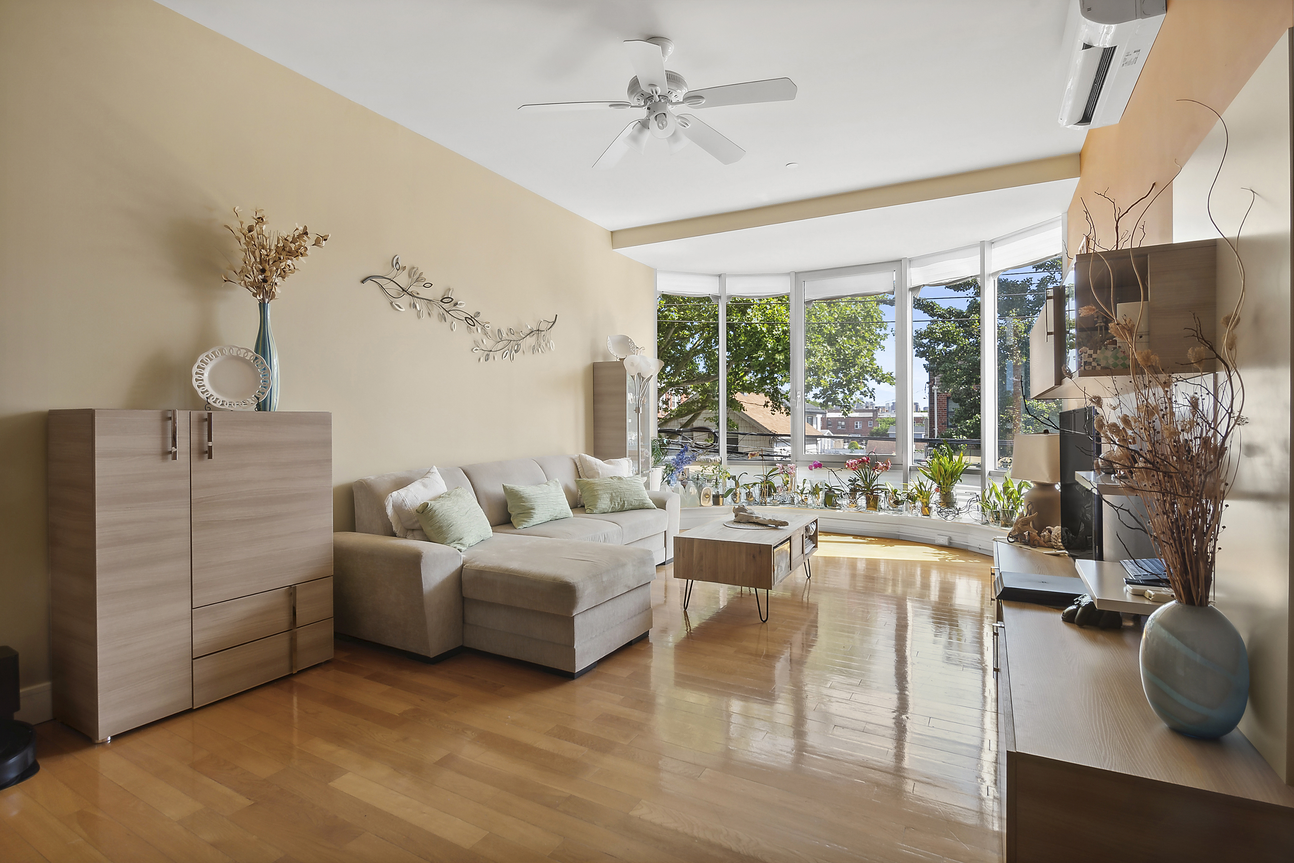 a living room with furniture and a large window