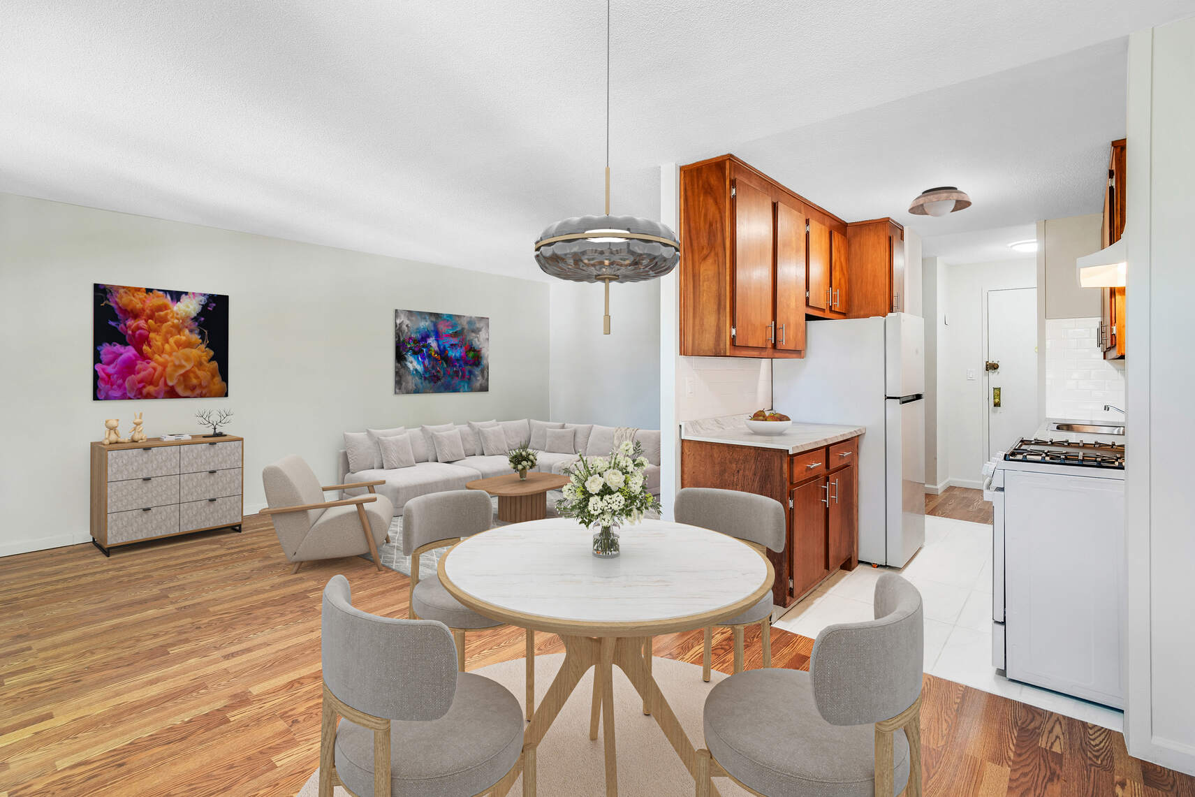 a view of kitchen with furniture and wooden floor