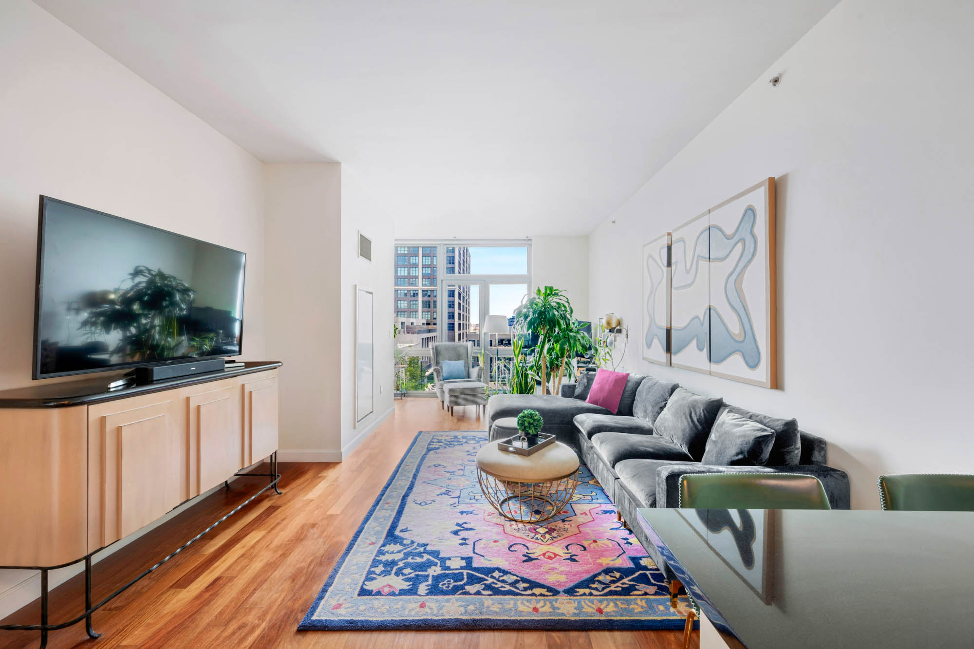 a living room with furniture and a flat screen tv