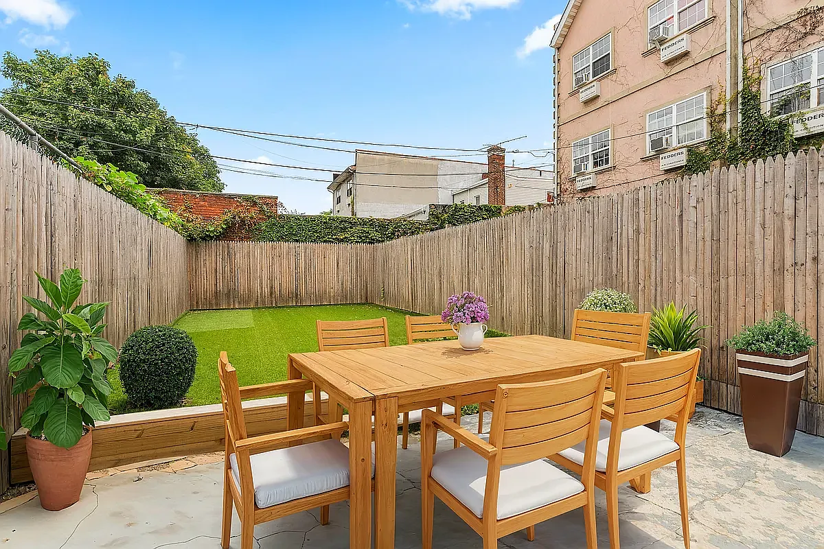 a view of outdoor dining space with a table and chairs