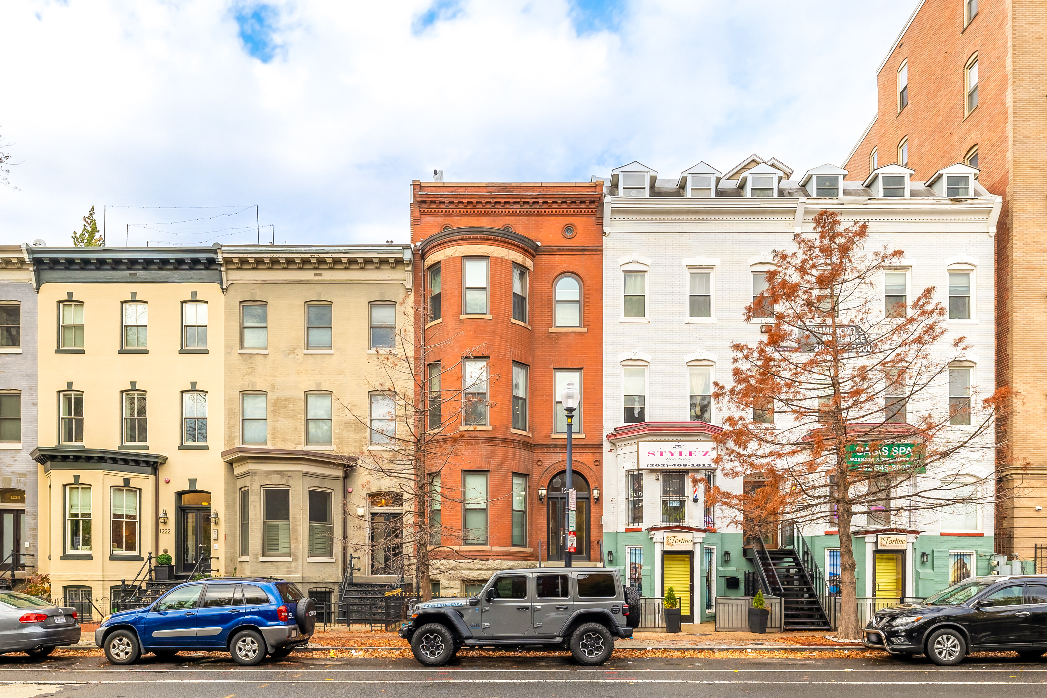 a buildings and car parked in front of it