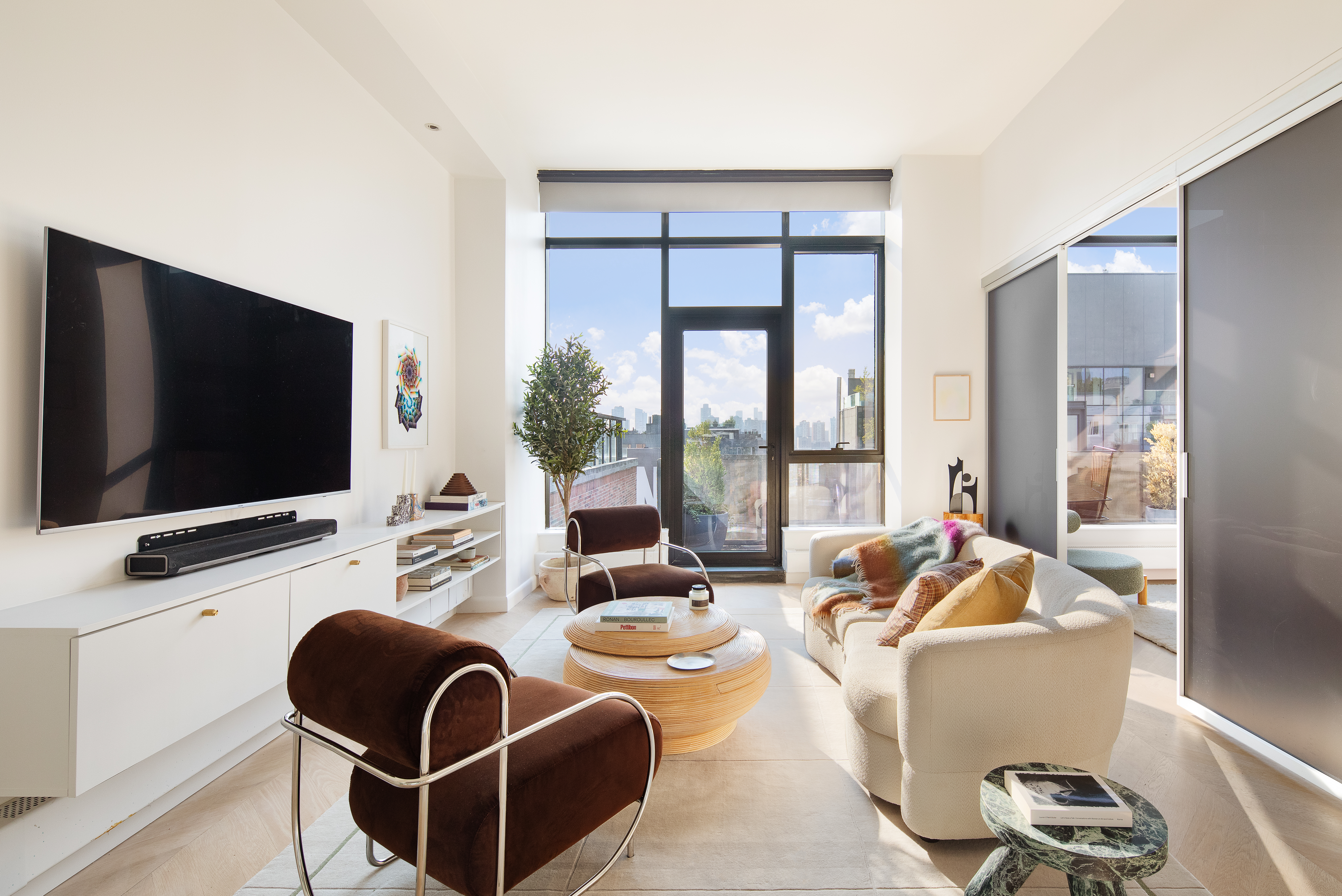 a room with furniture and a flat screen tv