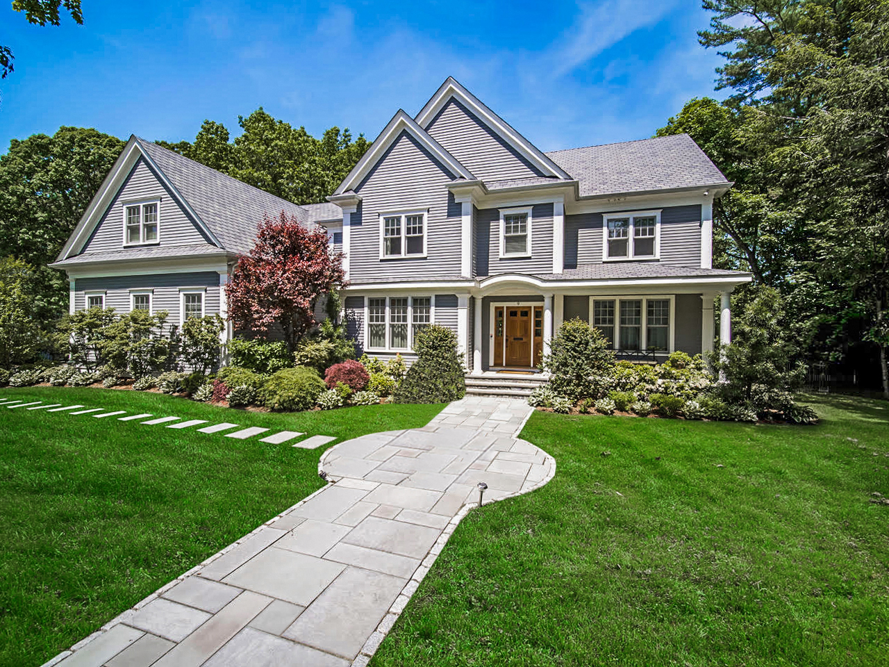 a front view of a house with a yard