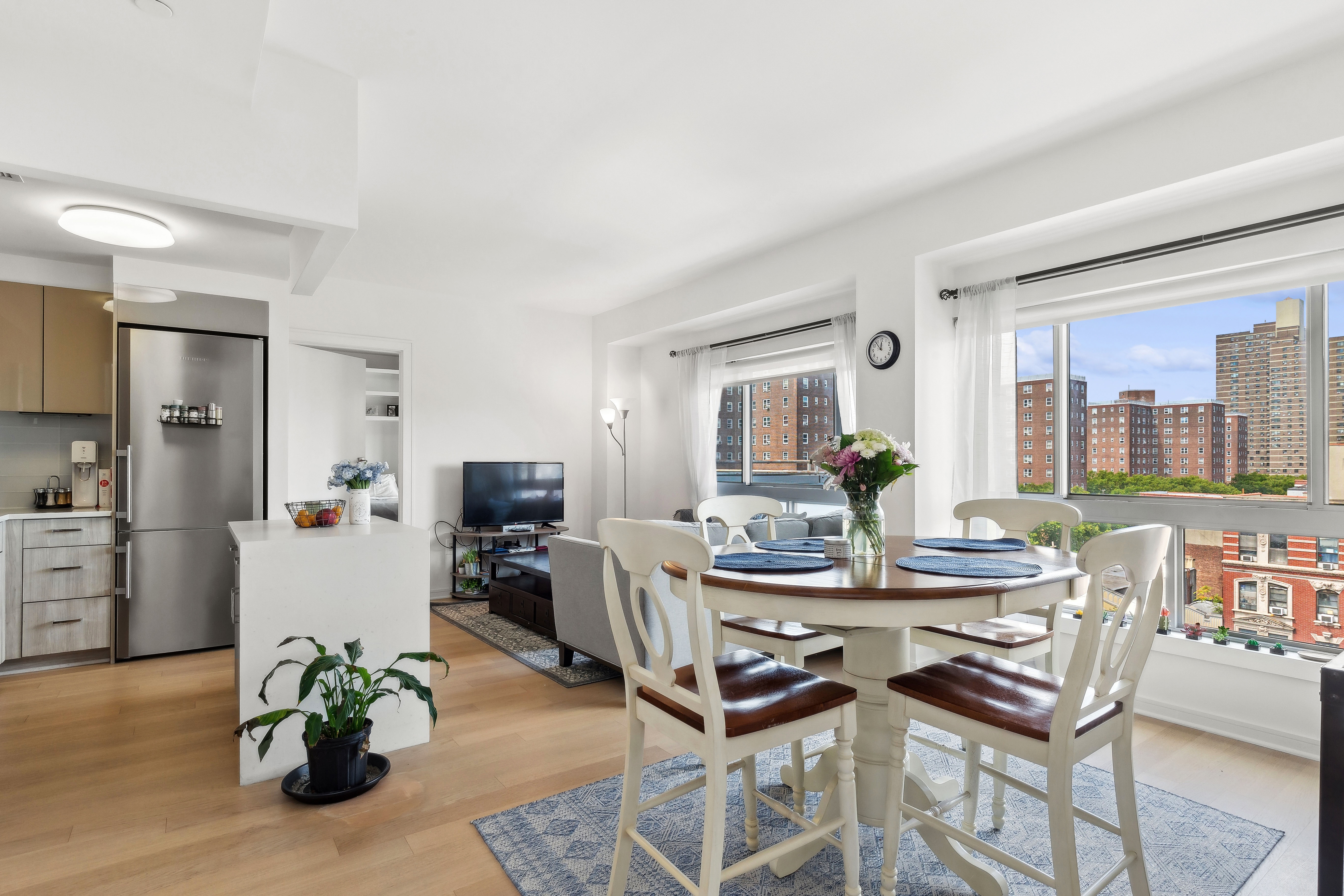 a dining room with furniture and wooden floor