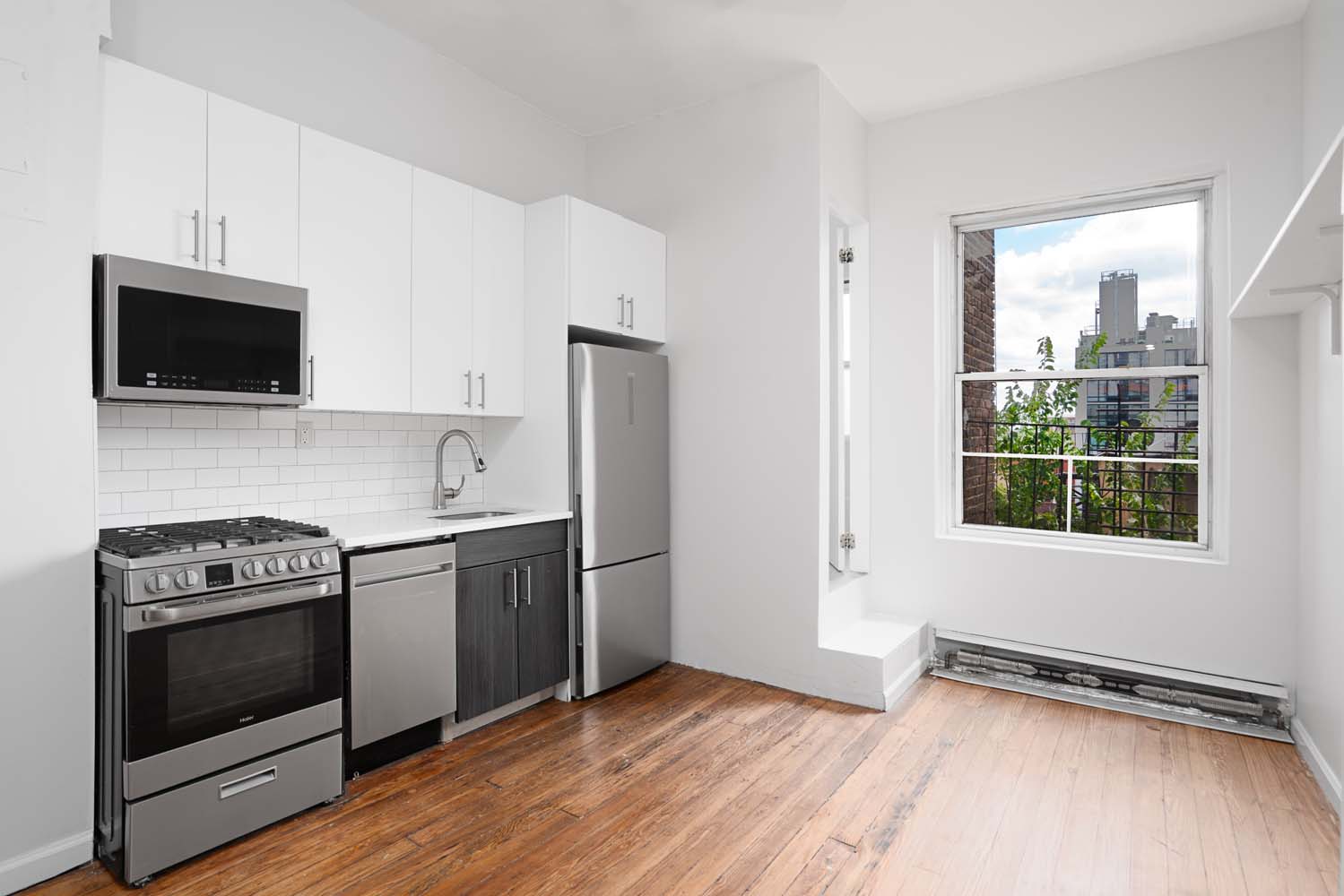 a kitchen with a stove and a microwave