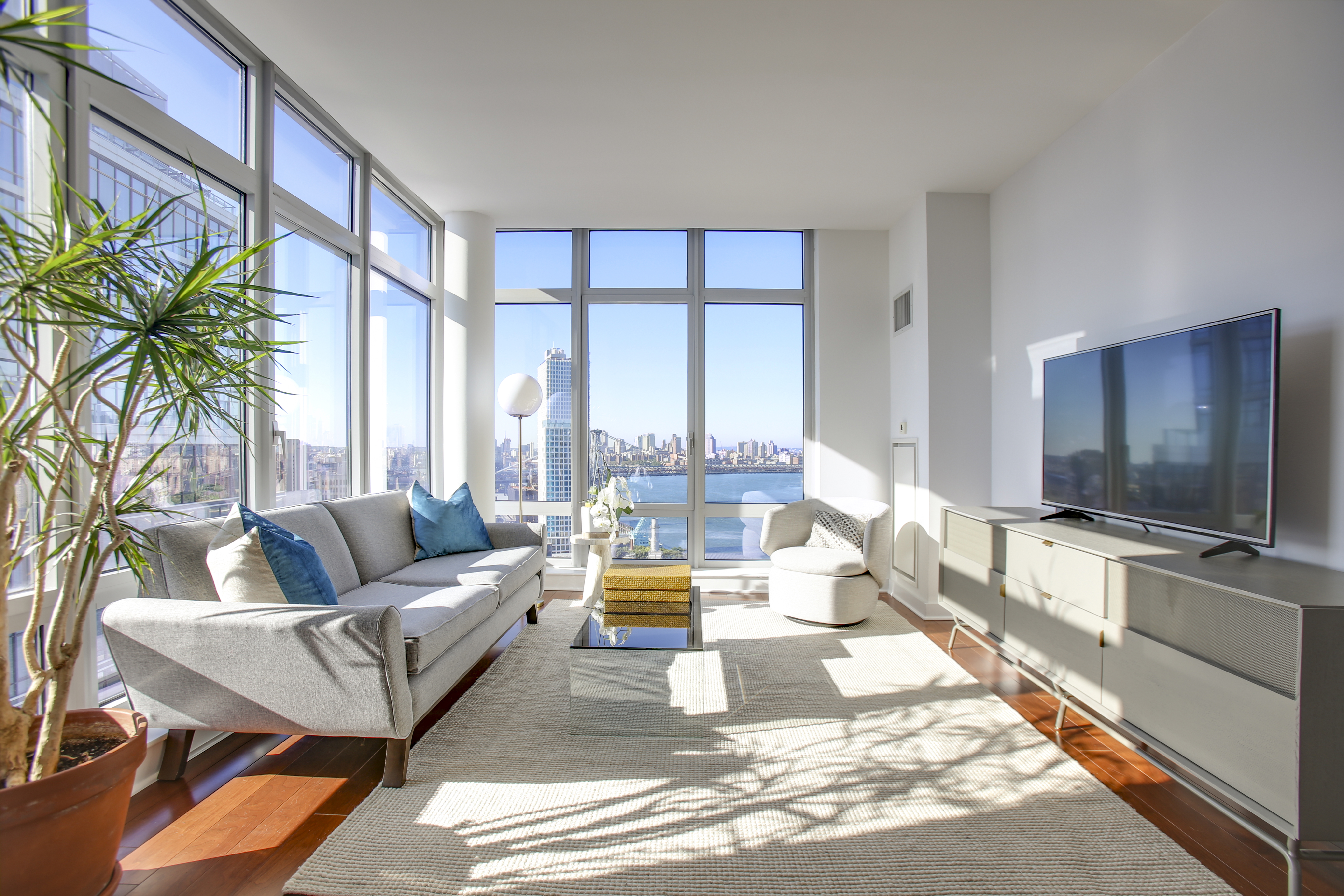 a living room with furniture and a flat screen tv