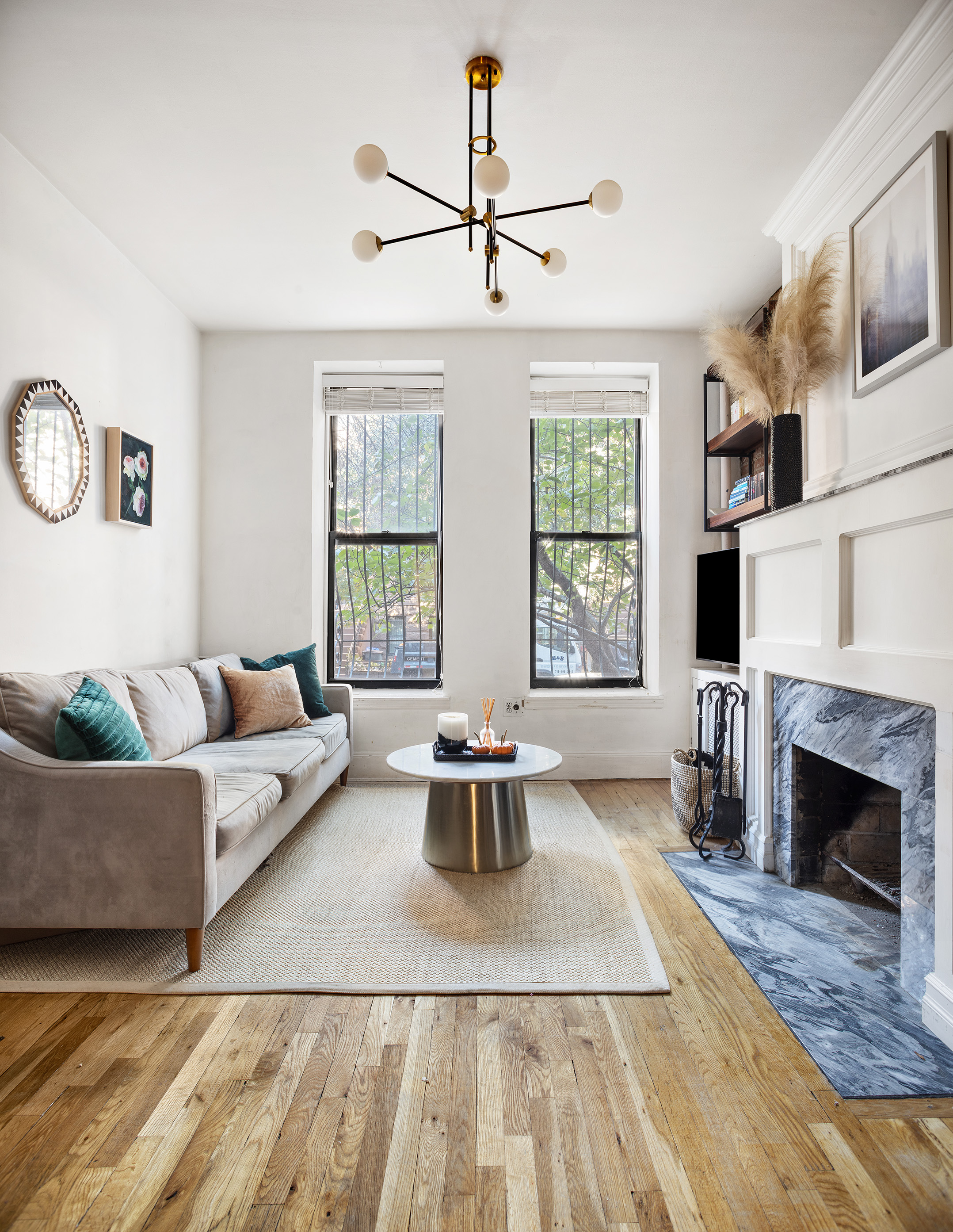 a living room with furniture fireplace and window