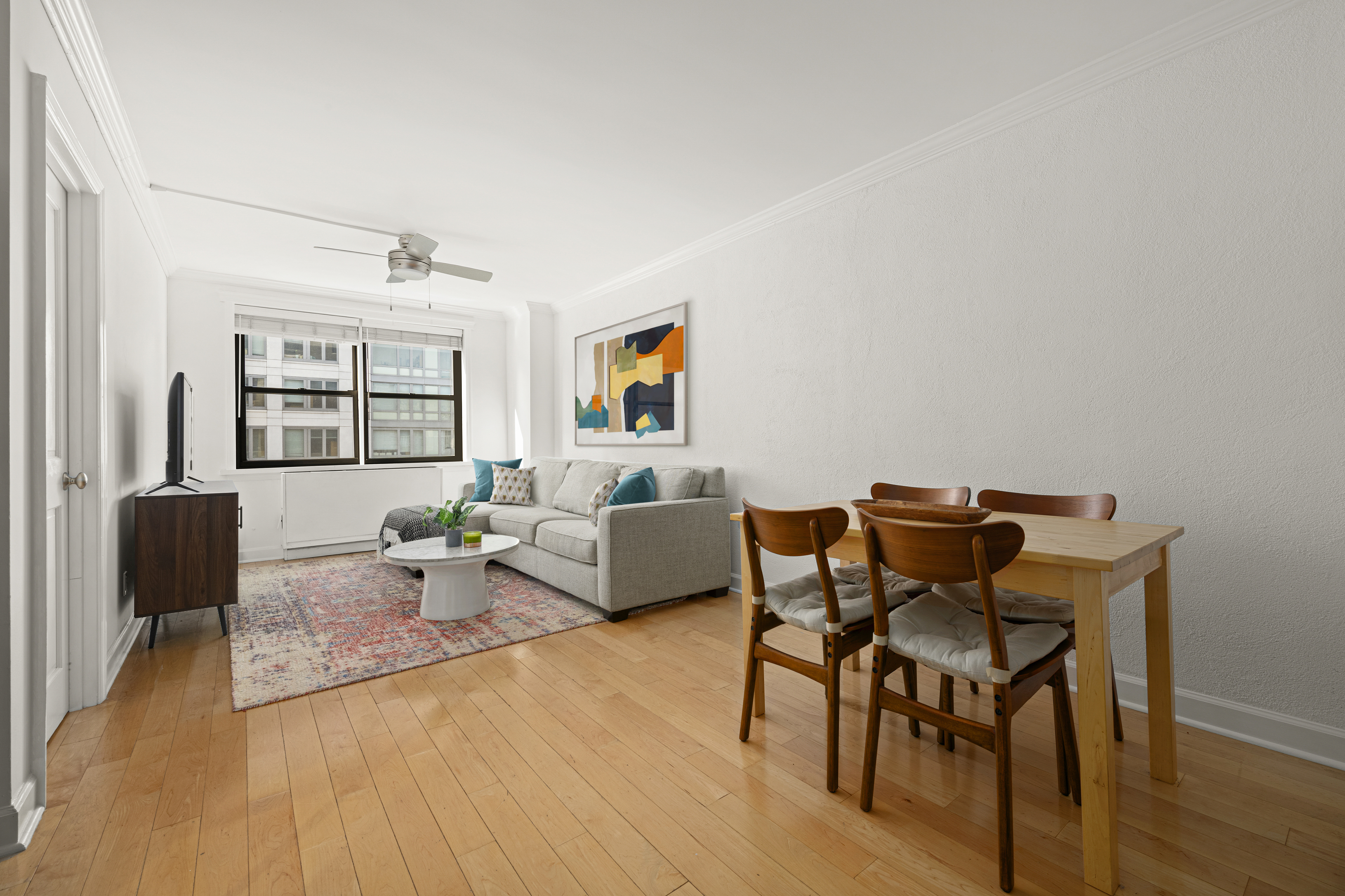 a living room with furniture and a window