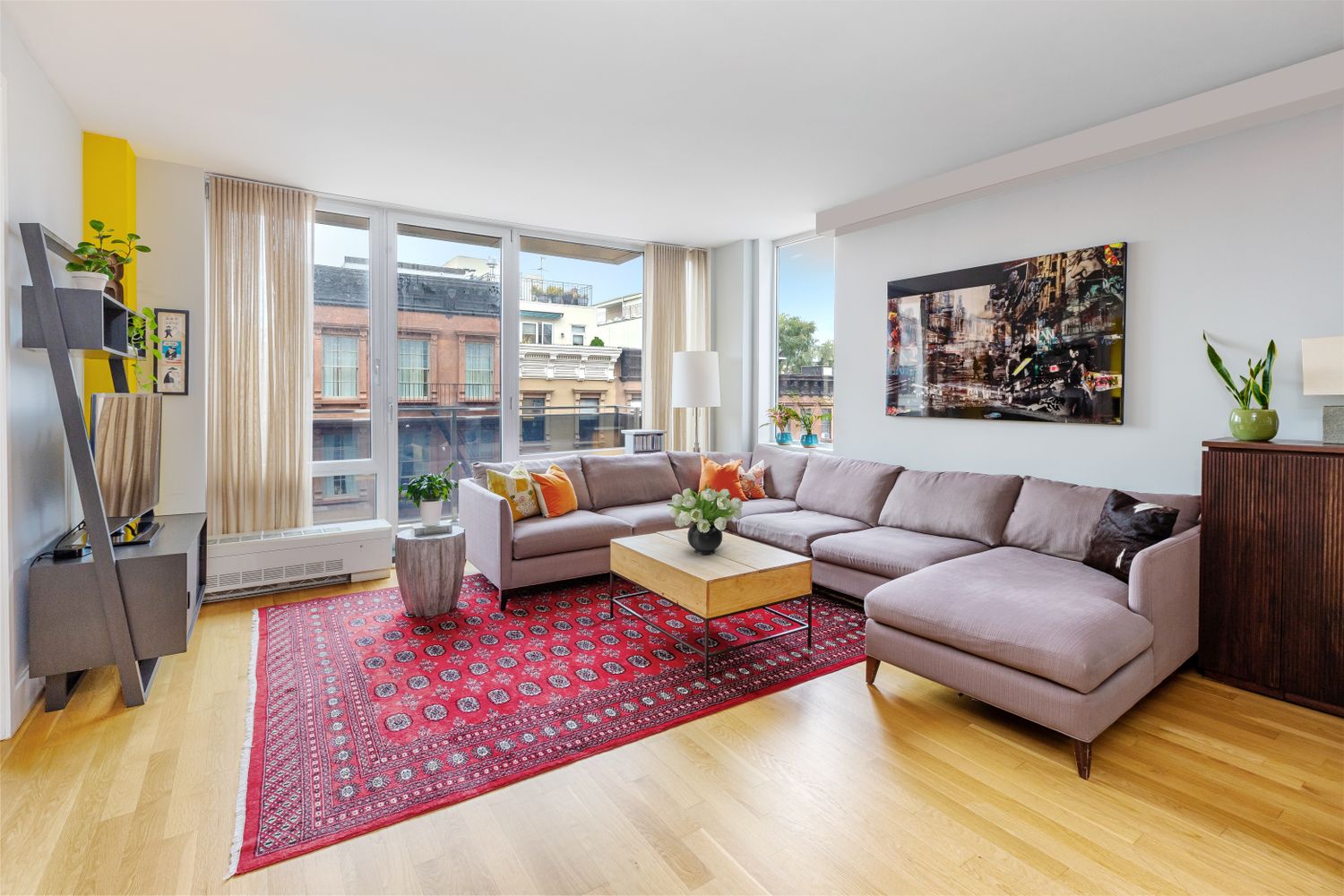 a living room with furniture and a book shelf