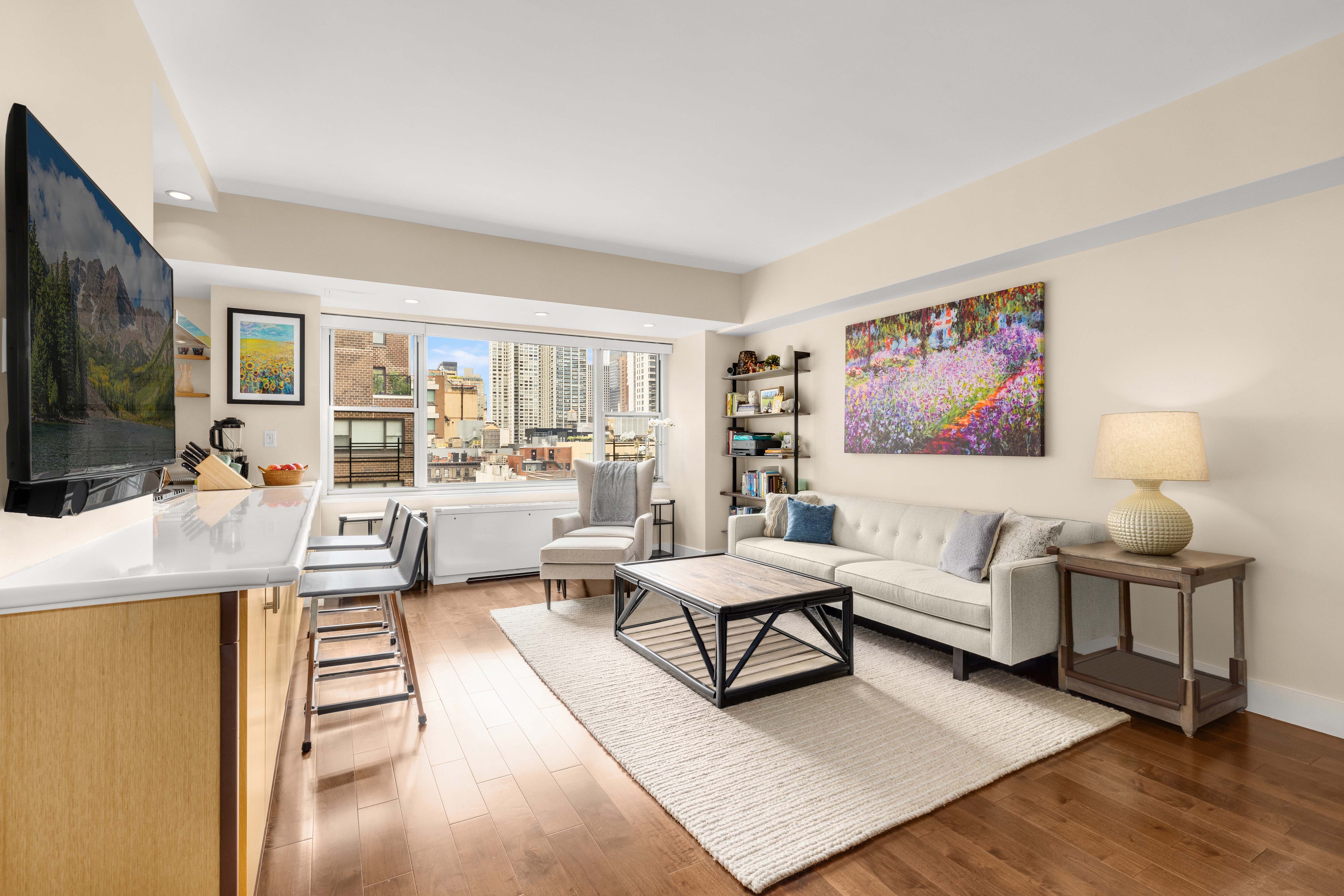 a living room with furniture and a flat screen tv