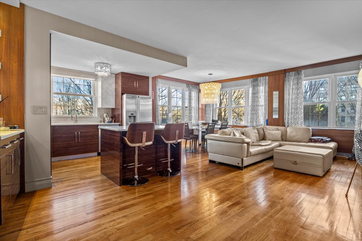 a living room with furniture and large windows