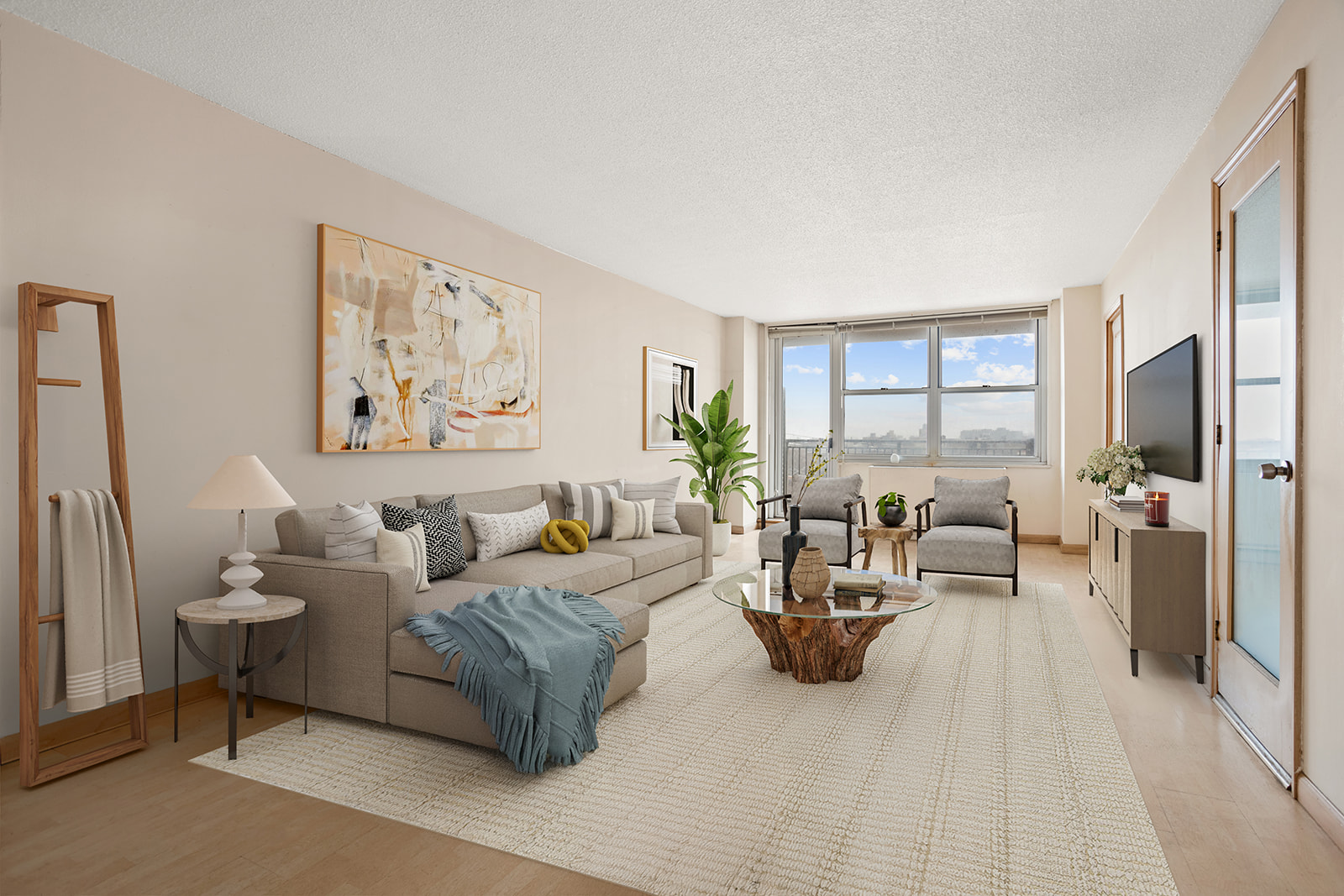 a living room with furniture large window and a table