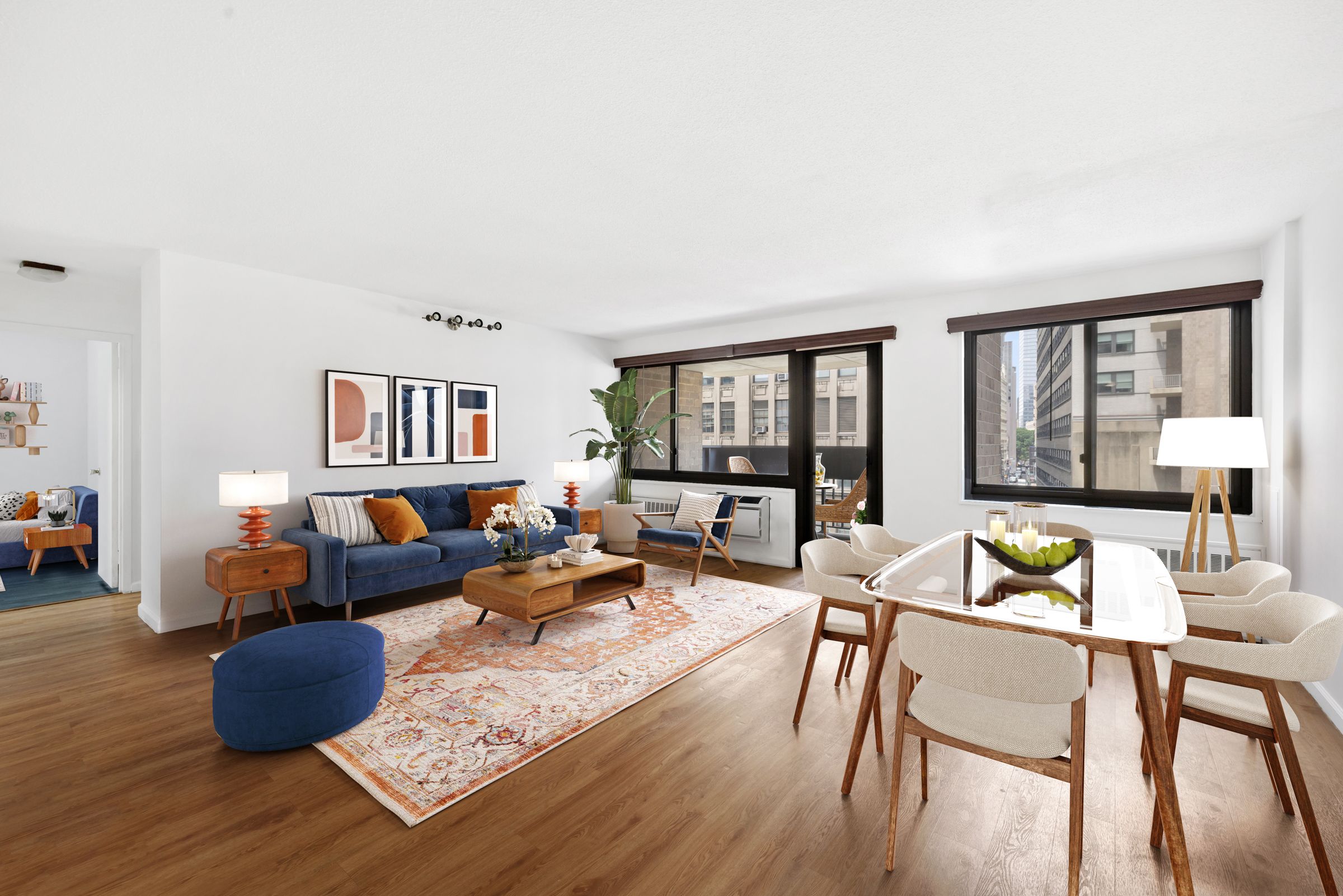 a living room with furniture and a floor to ceiling window