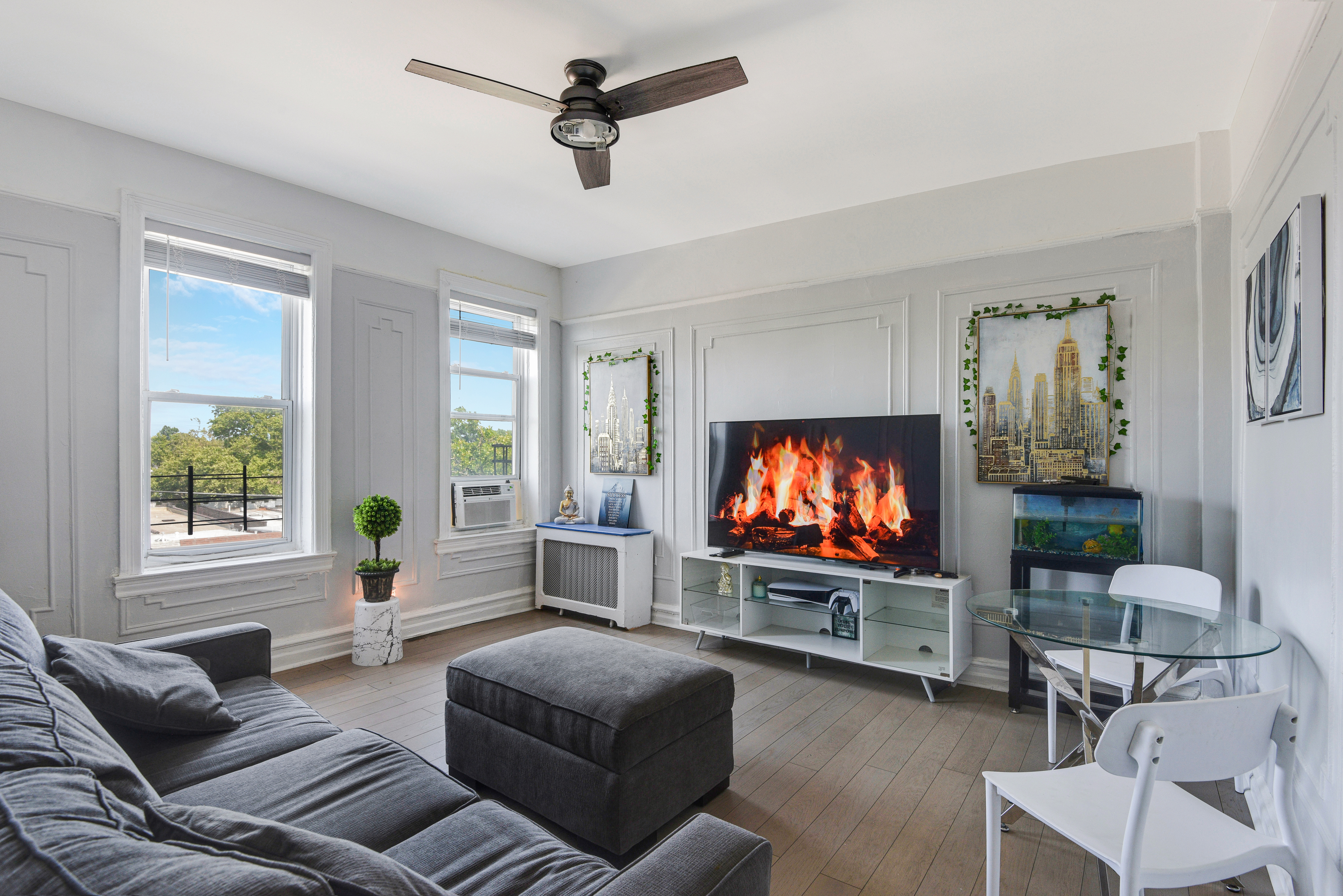 a living room with furniture and a flat screen tv