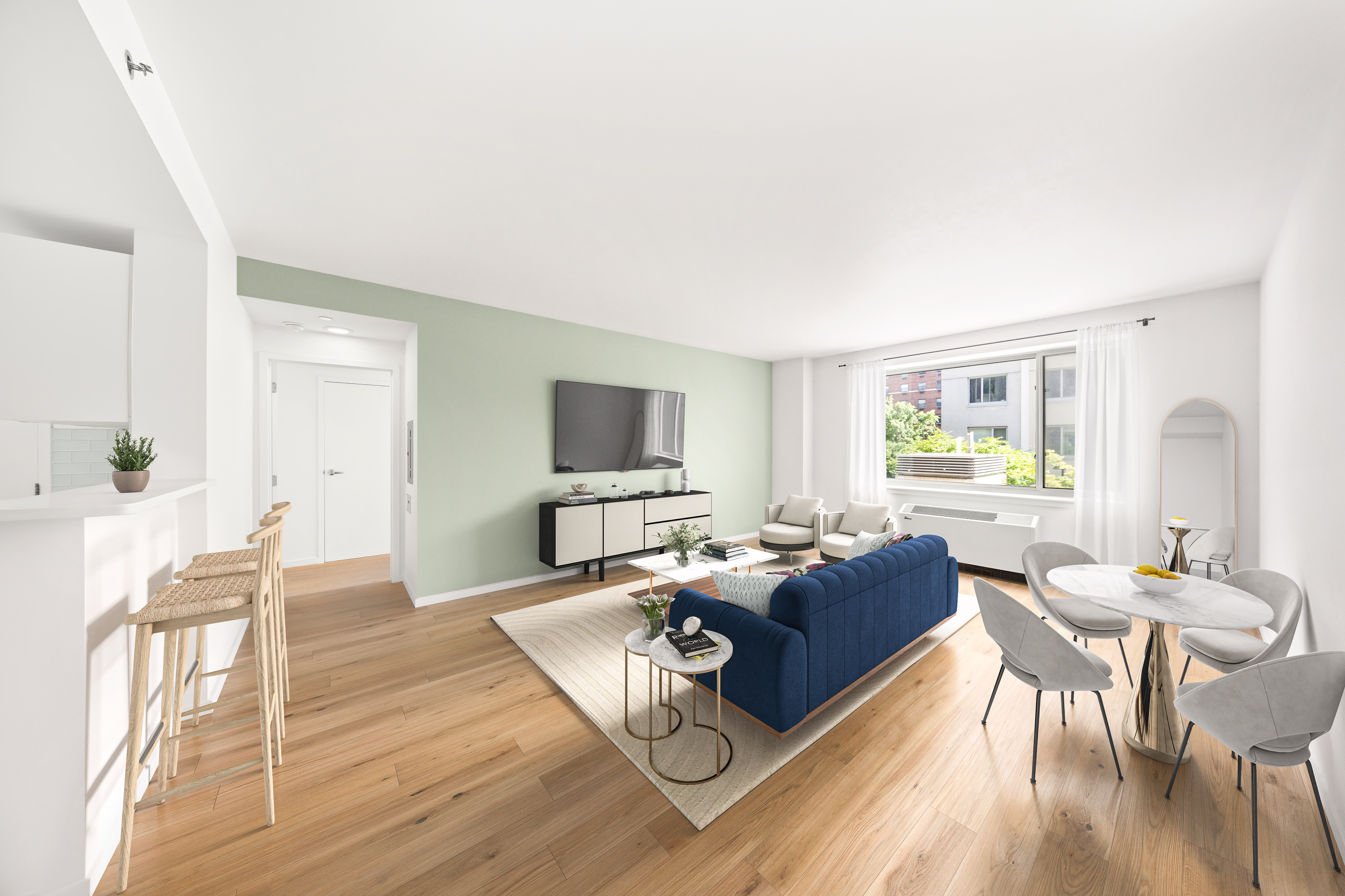 a living room with furniture a wooden floor and a flat screen tv