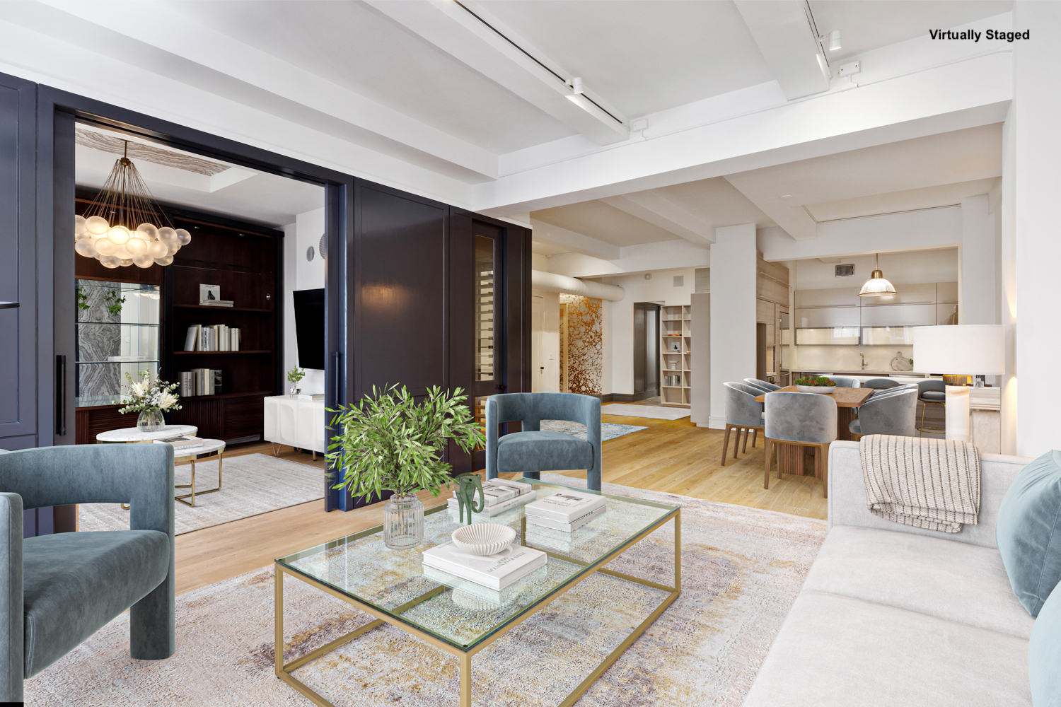 a living room with furniture and view of kitchen