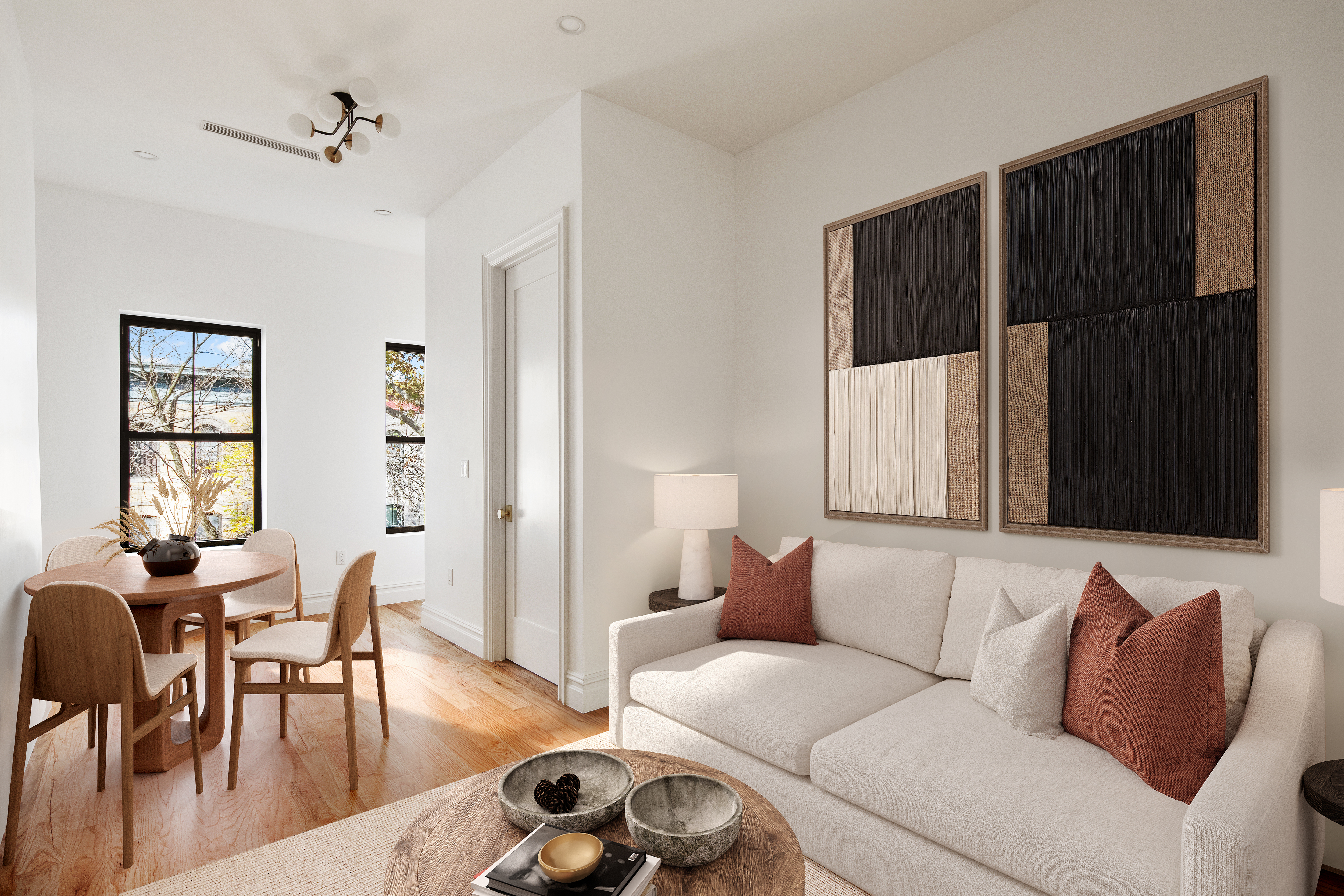 a living room with furniture window and wooden floor