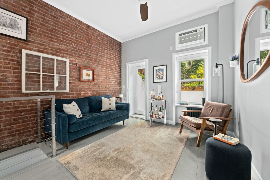 a living room with furniture and a window