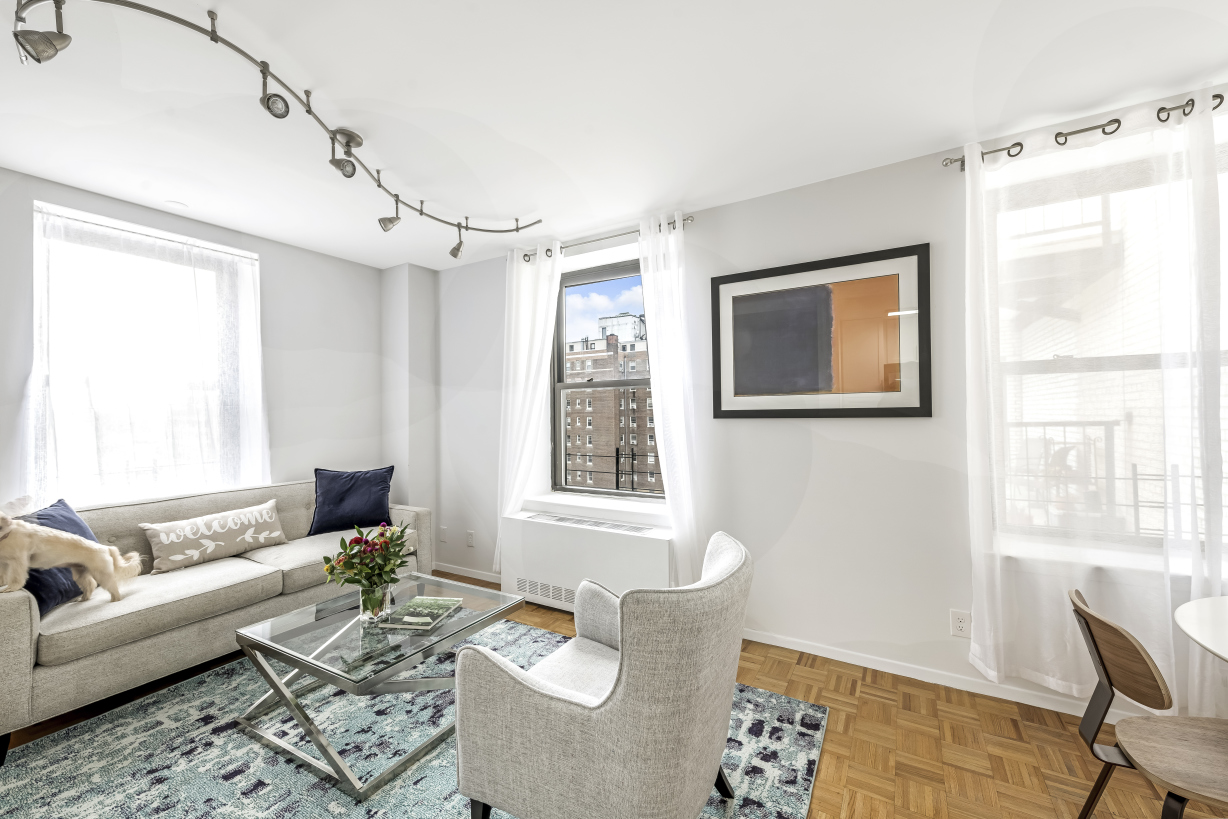 a living room with furniture and a window