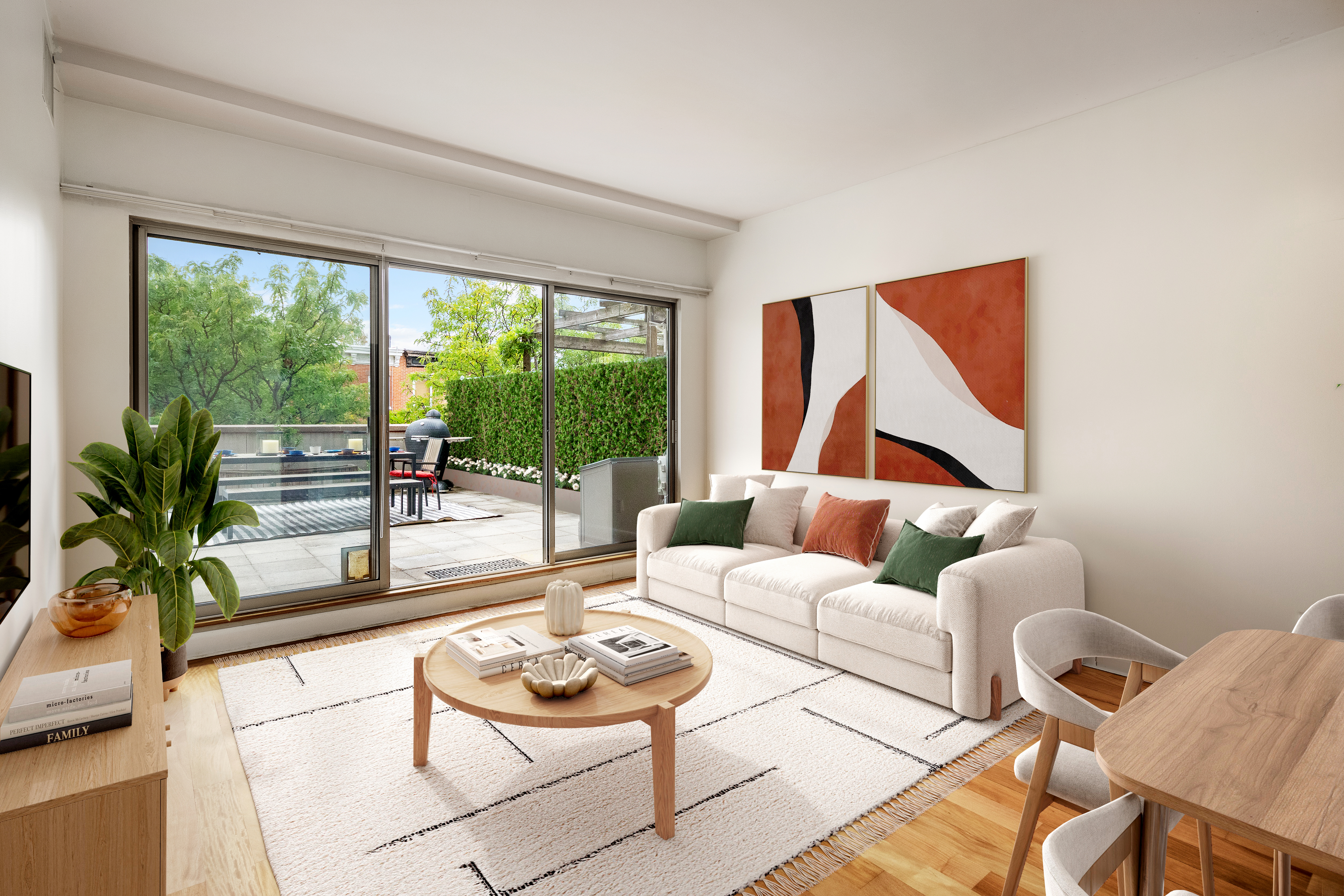 a living room with furniture and a floor to ceiling window