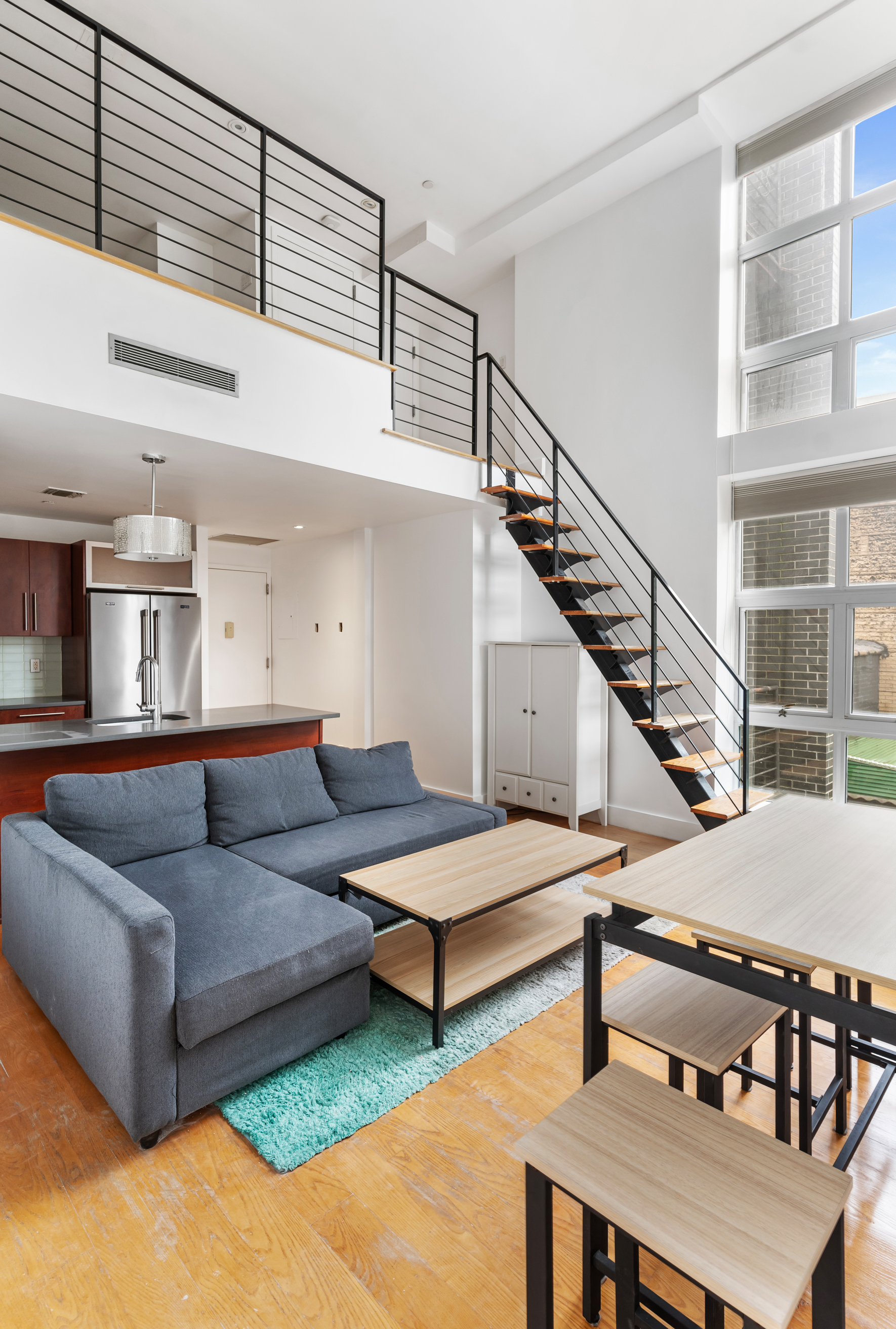 a living room with furniture and a table