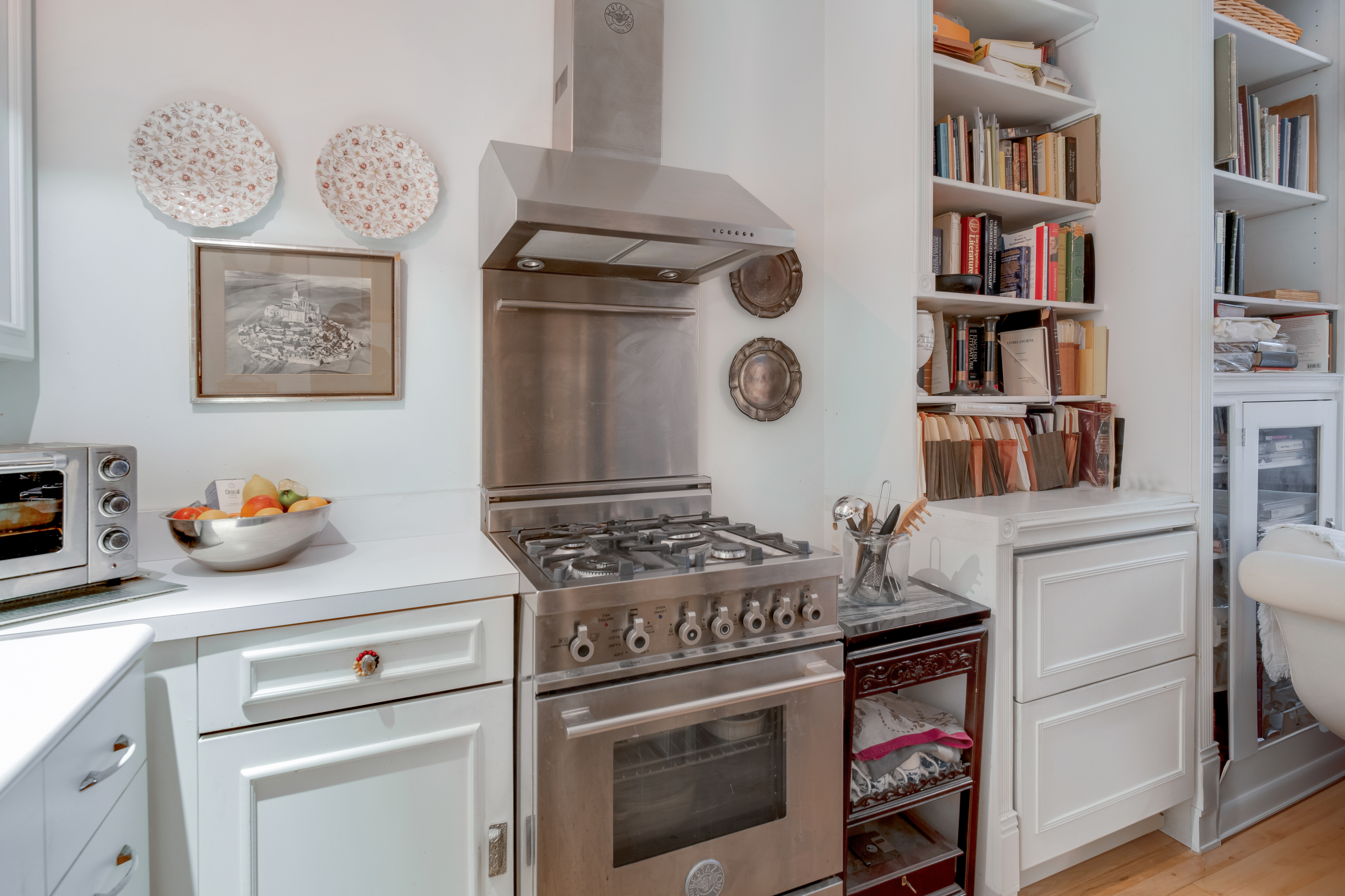 a kitchen with a stove and cabinets