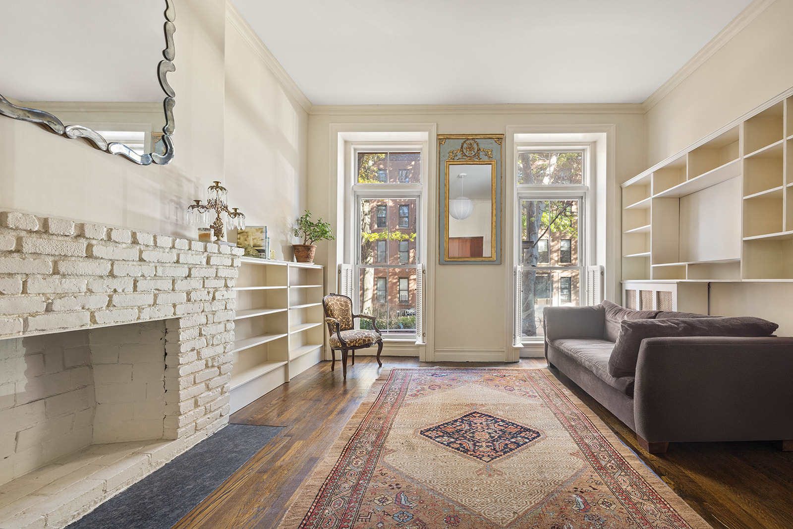 a living room with furniture a rug and a window