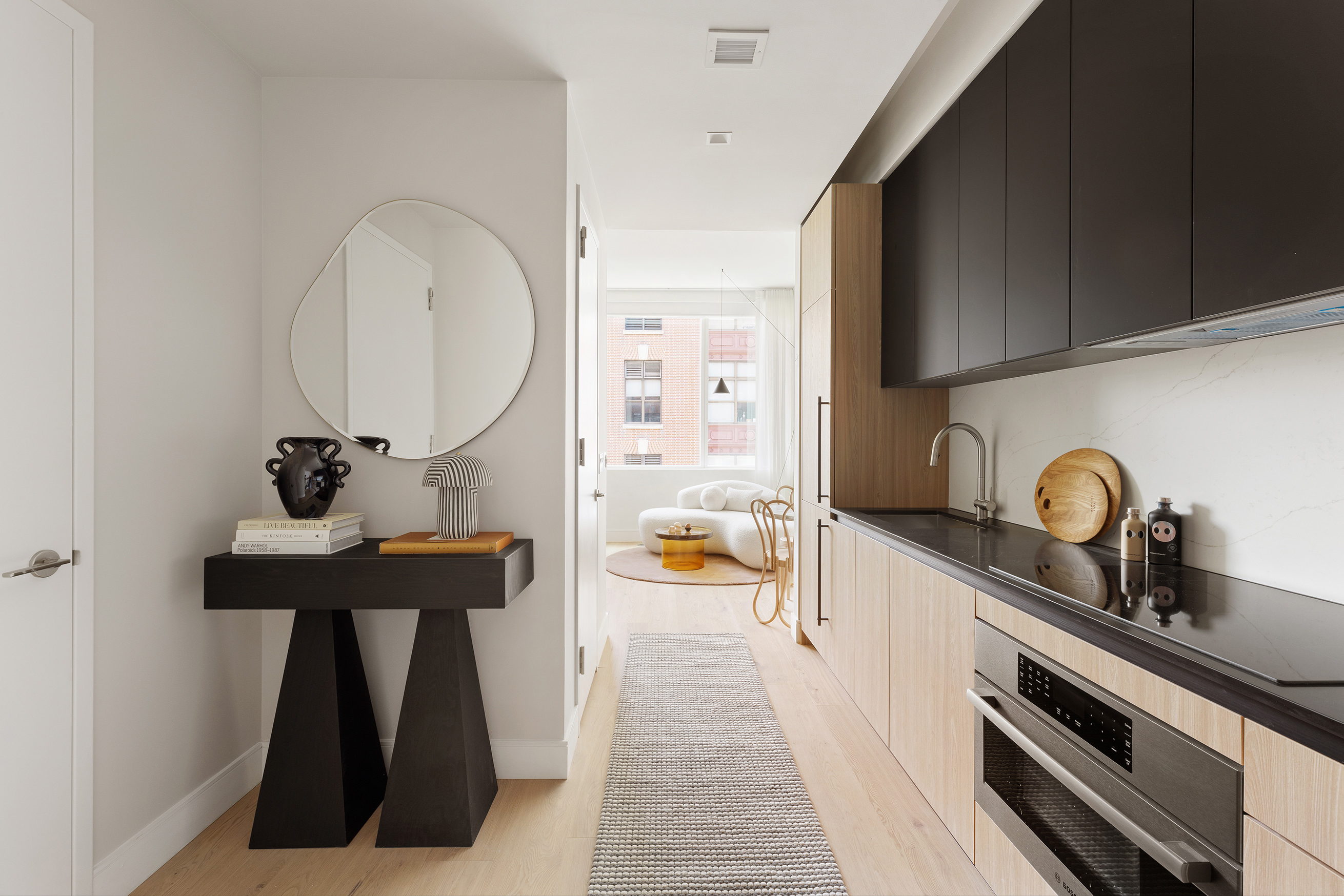 a kitchen with stainless steel appliances a sink stove and cabinets