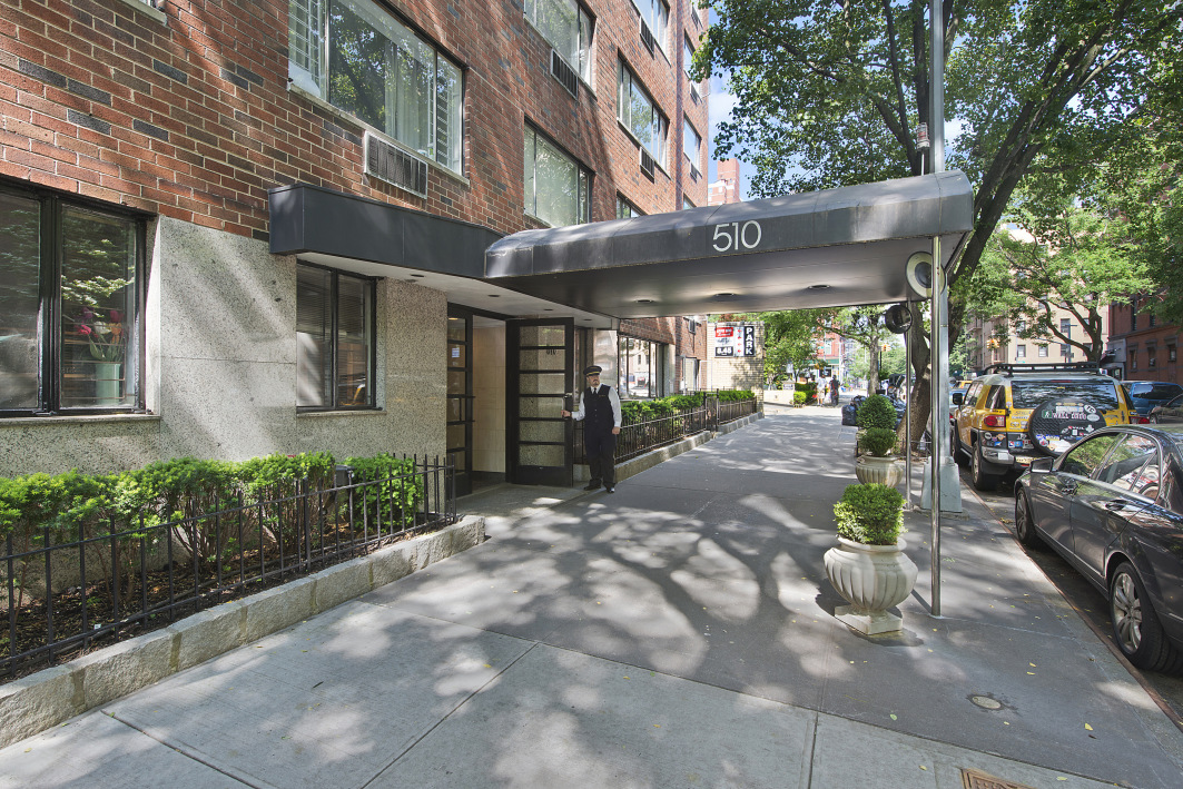 a view of a building with a garden