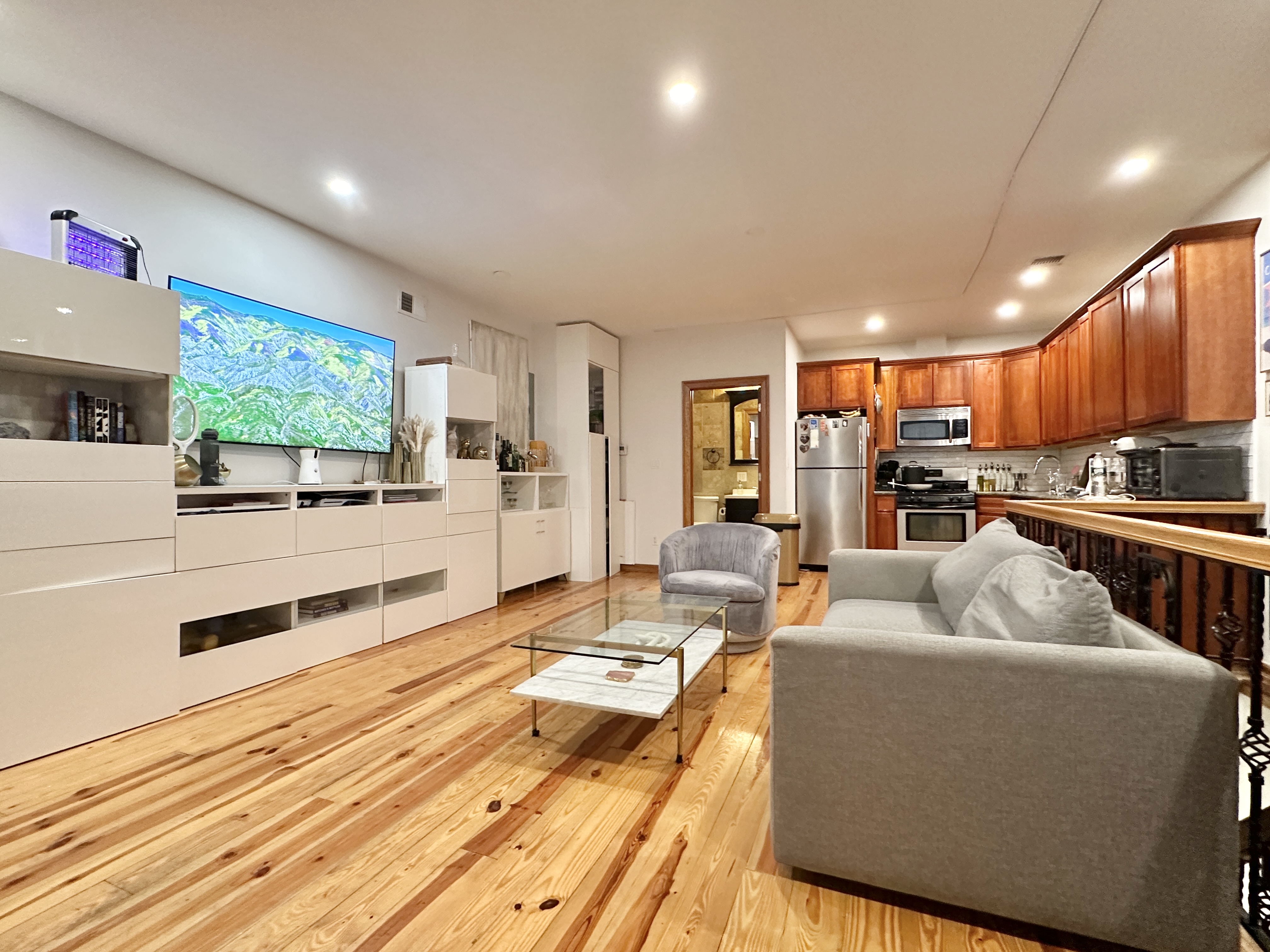 a living room with furniture and a flat screen tv