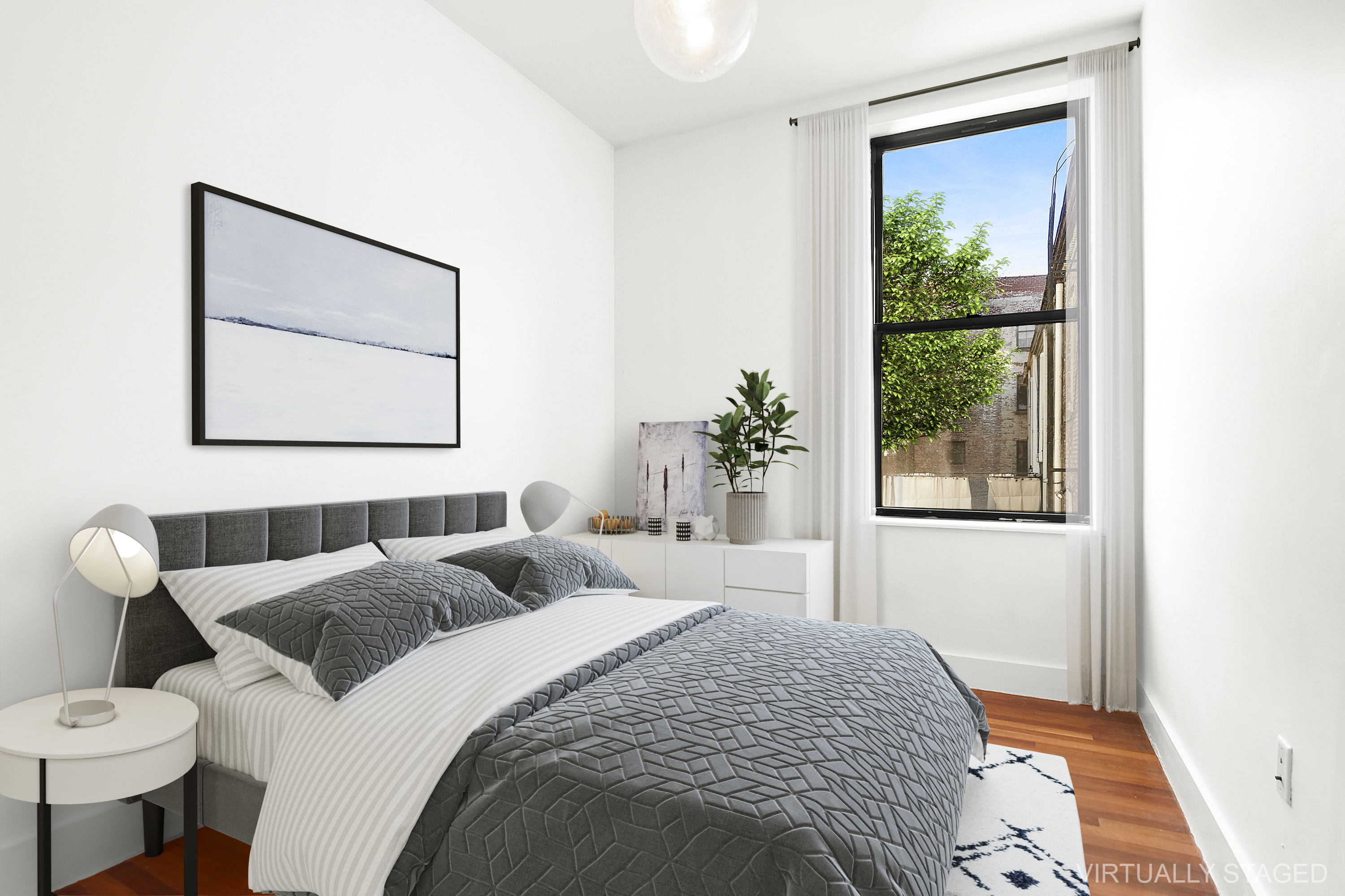 a bedroom with a bed and a painting on the wall