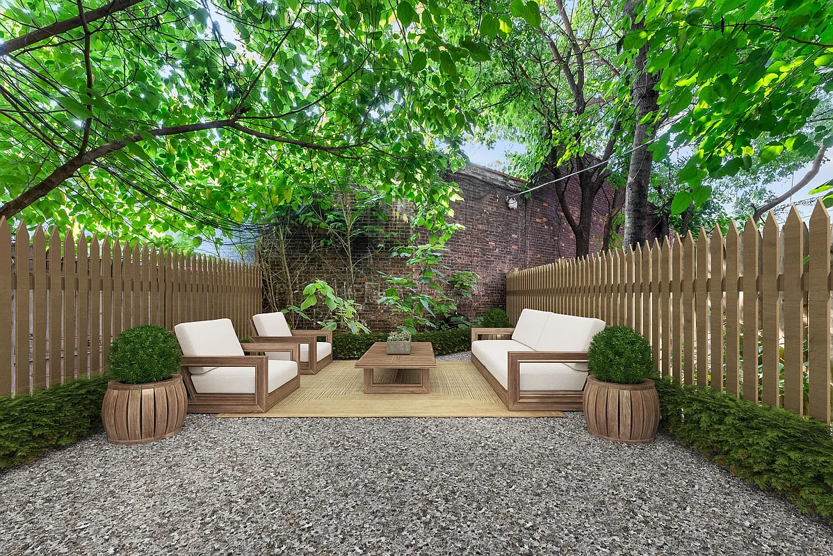 a view of a patio with couches and a table and chairs with wooden fence and plants