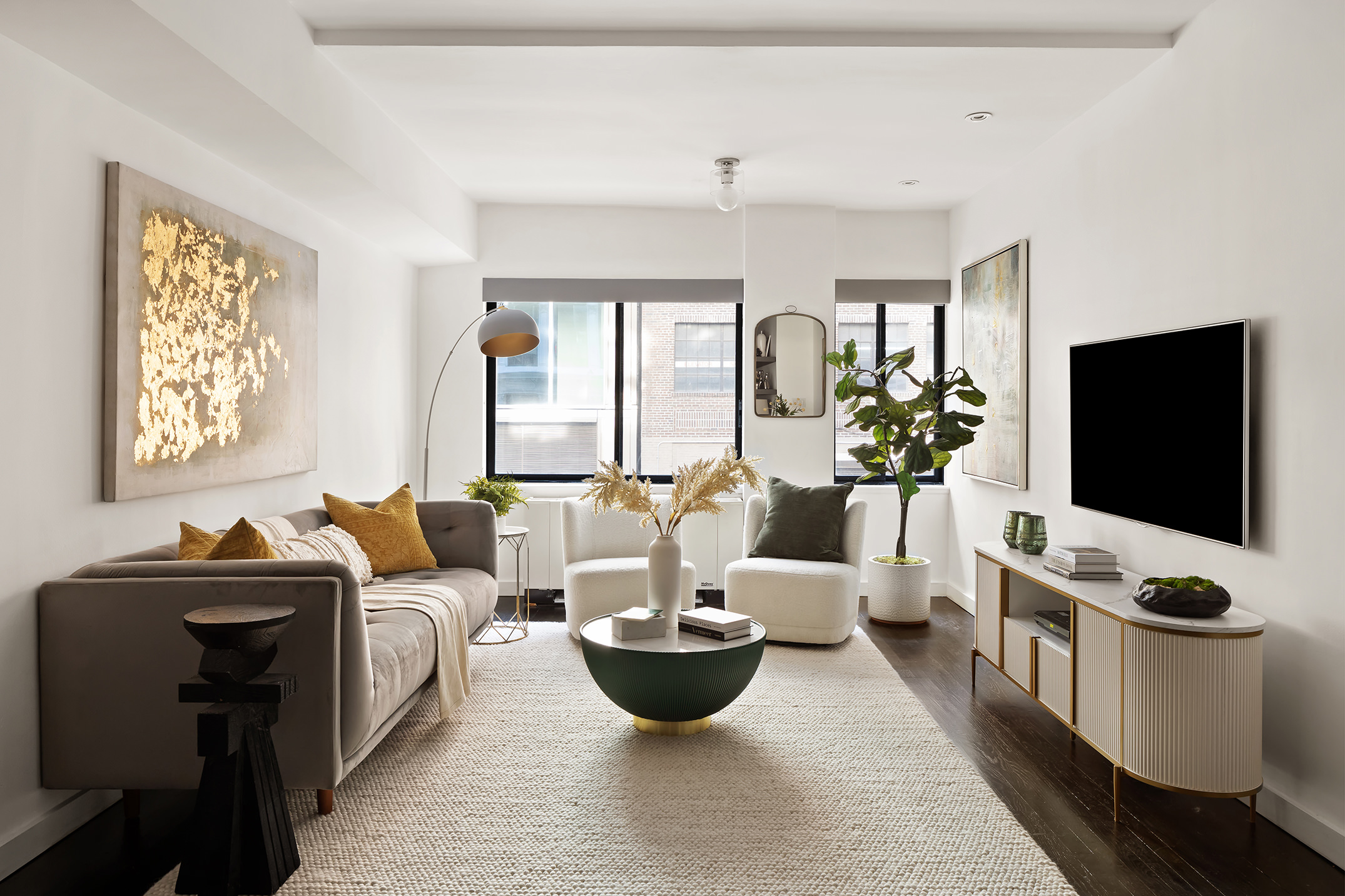 a living room with furniture a flat screen tv and a large window