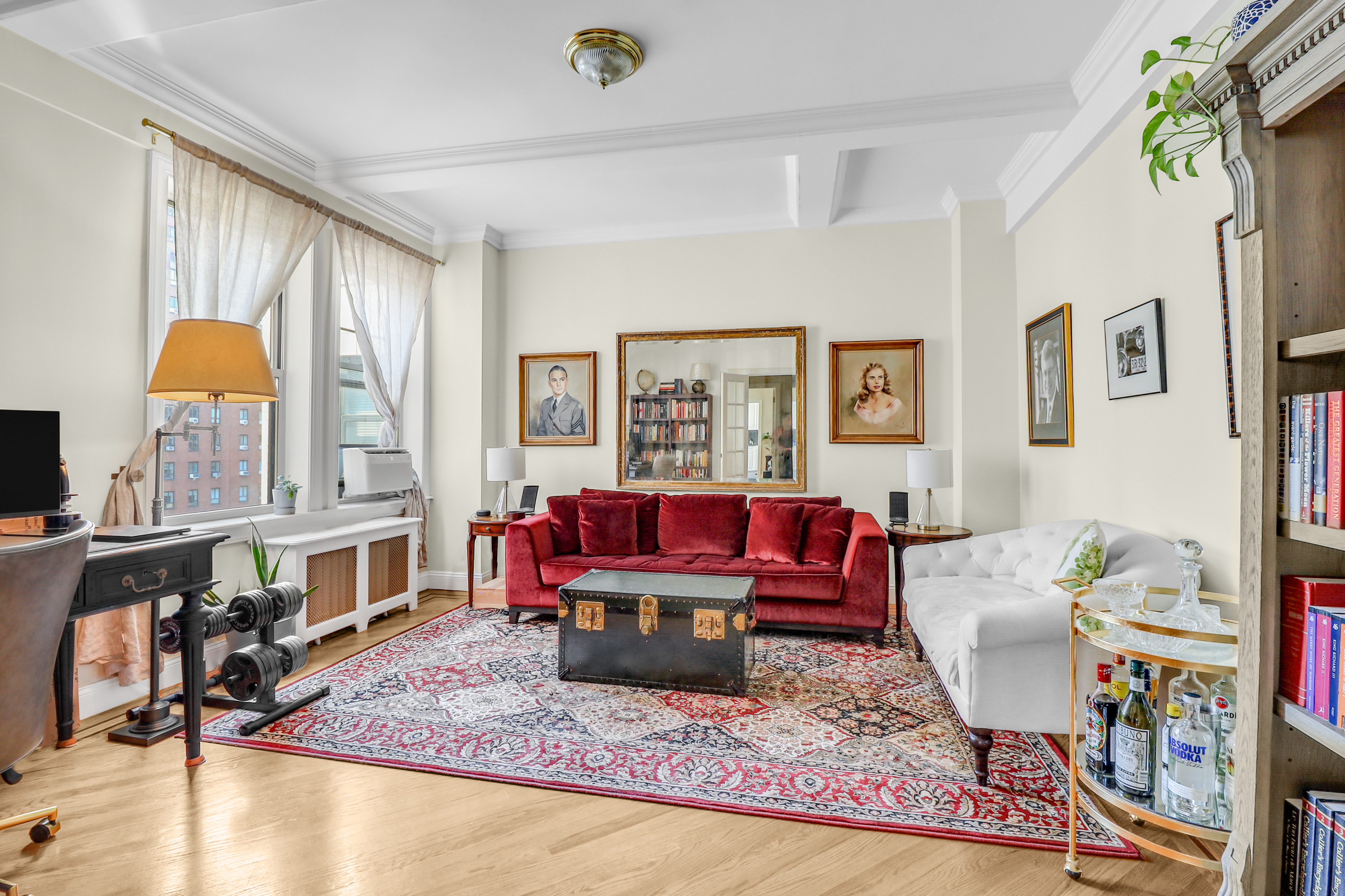 a living room with furniture and a rug