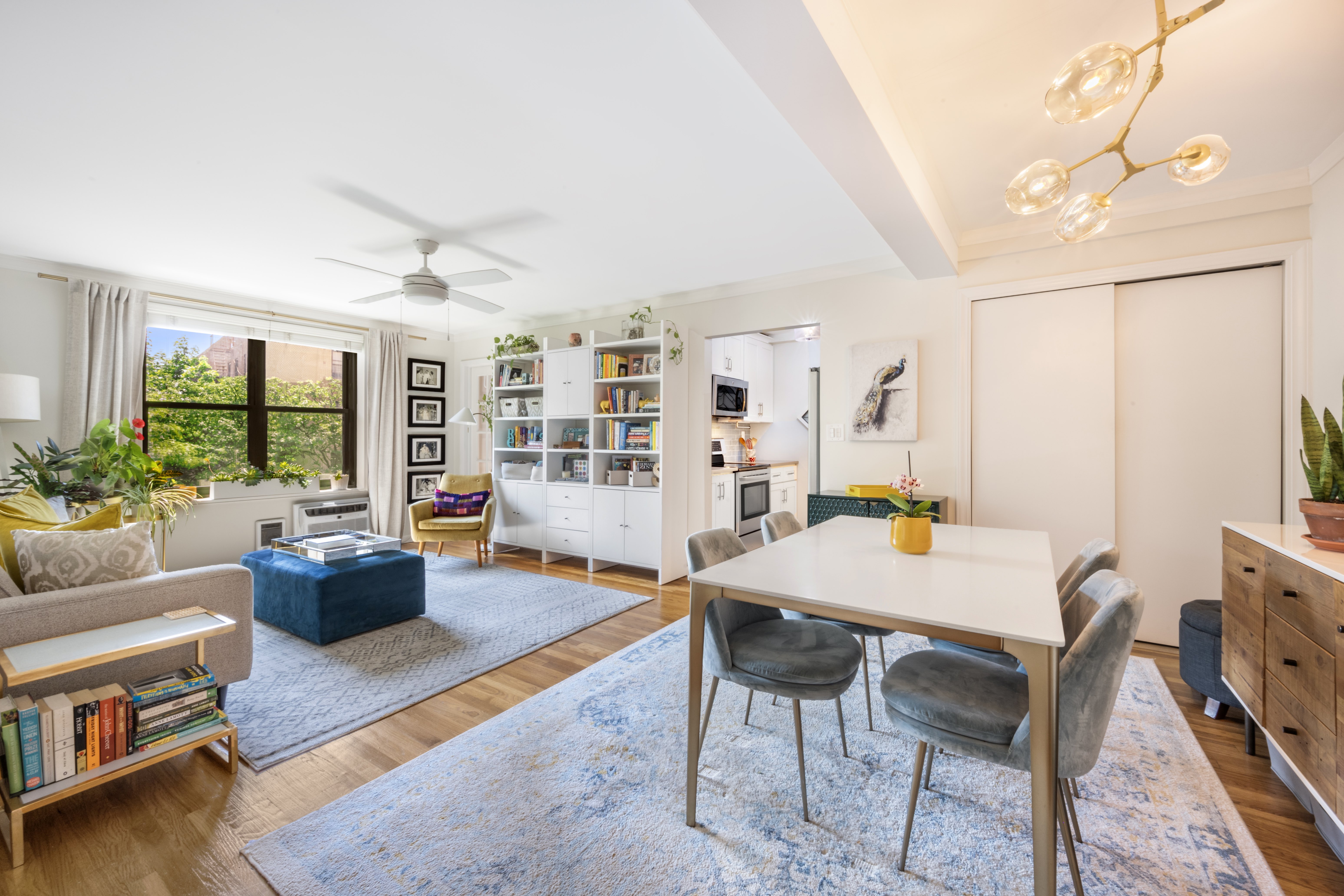 a view of a livingroom with furniture and a dining table