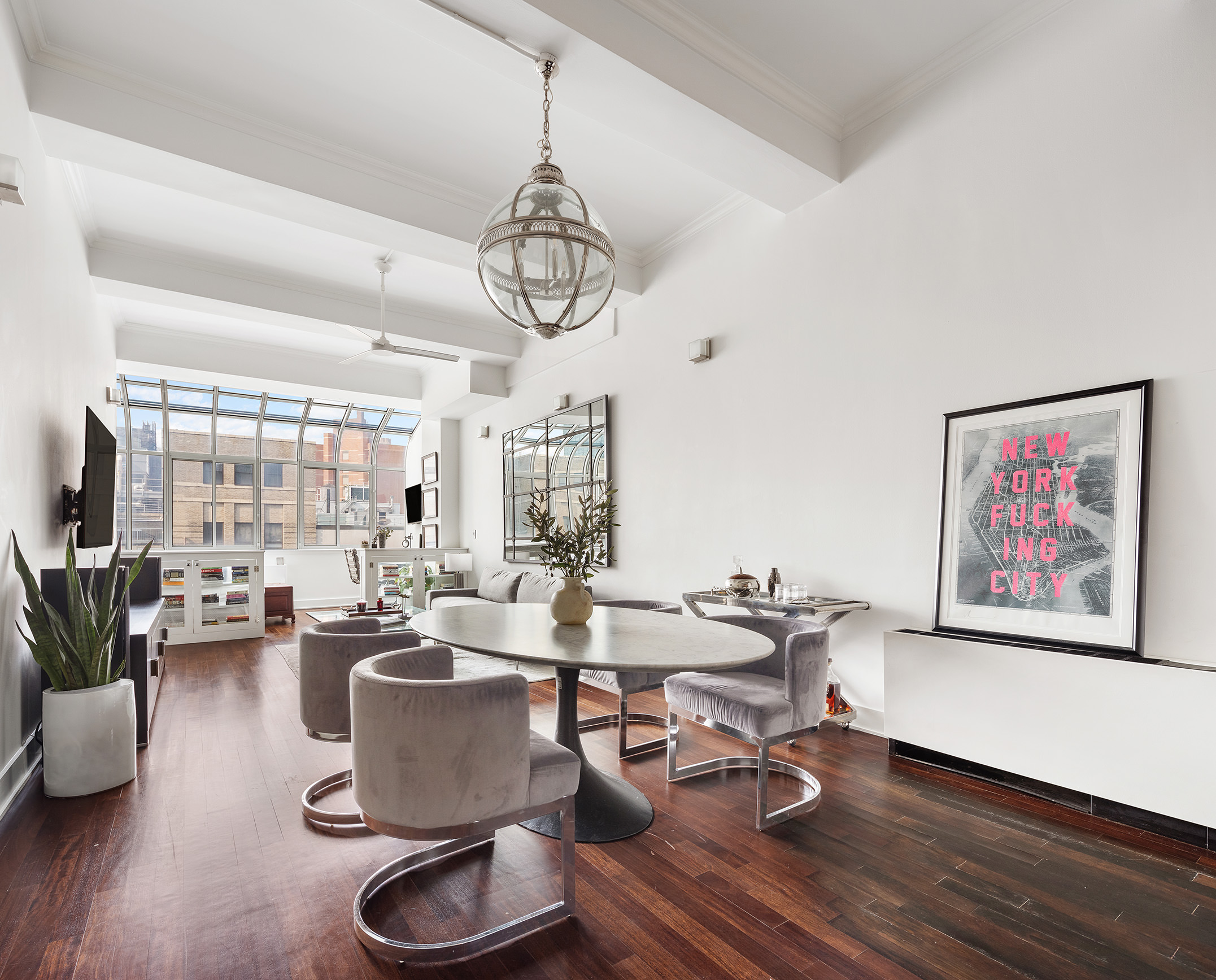 a room with lots of furniture and wooden floor